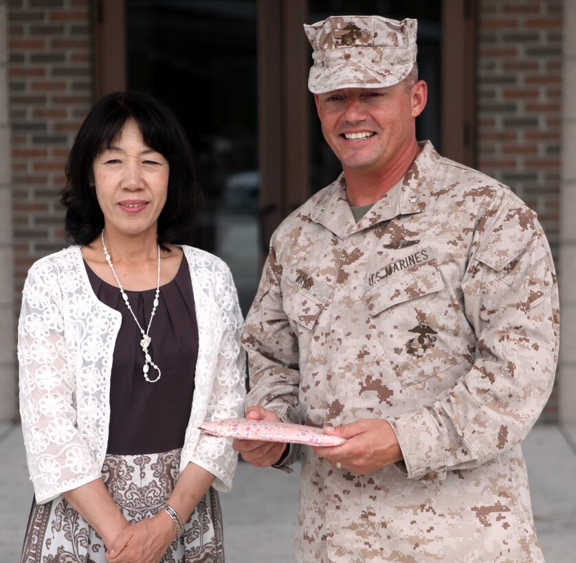 Toshiko Iwasaki, wife of the Chief of Staff for Japan’s Self-Defense Forces Gen. Shigeru Iwasaki, and Lt. Col. Nicholas Davis, commanding officer of Wounded Warrior Battalion- East, pose for a picture after he gave Iwasaki a tour of the wounded warrior barracks aboard Marine Corps Base Camp Lejeune Aug. 21. Iwasaki toured the barracks and Naval Hospital Camp Lejeune during her visit to the installation.