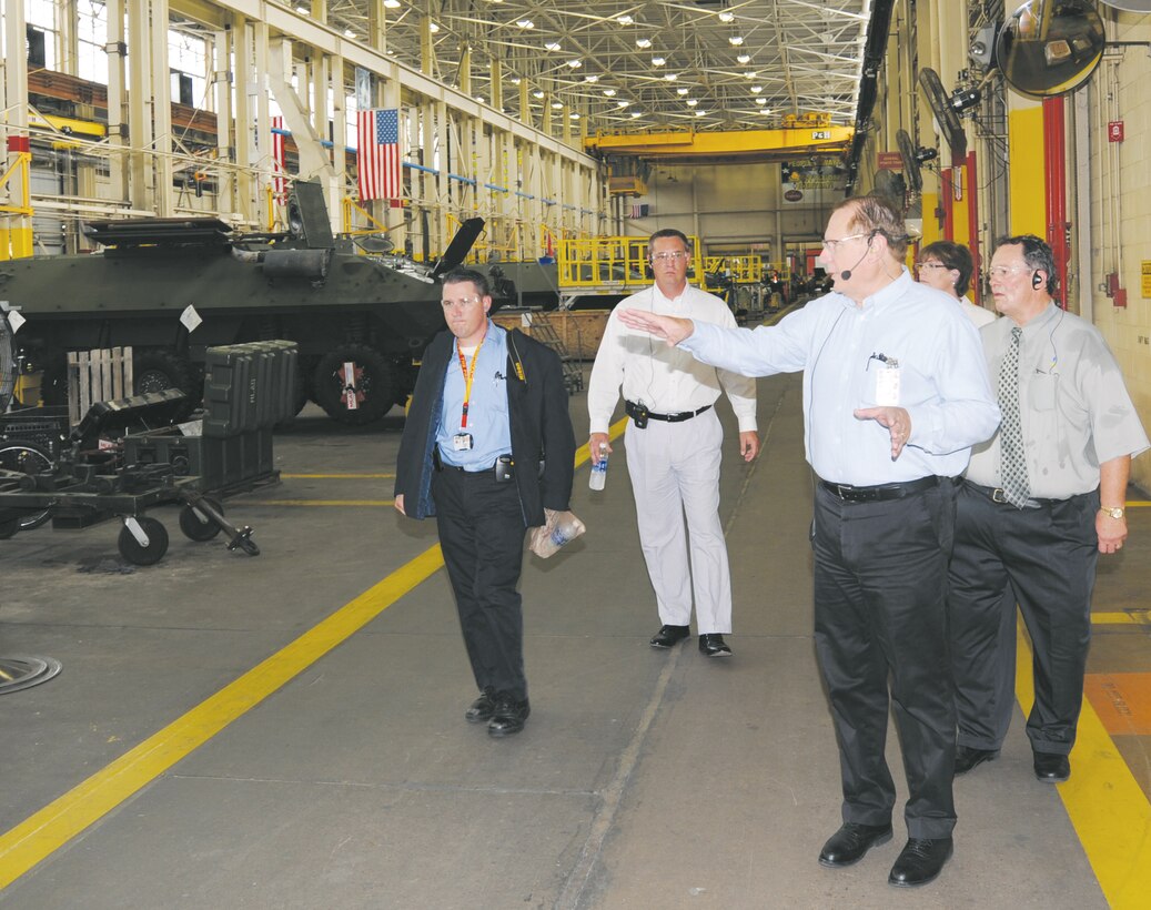 Patrick Shimko, plant manager, Production Plant Barstow, Calif., leads city officials from Albany and Barstow on a tour of Production Plant Albany, Aug. 16.