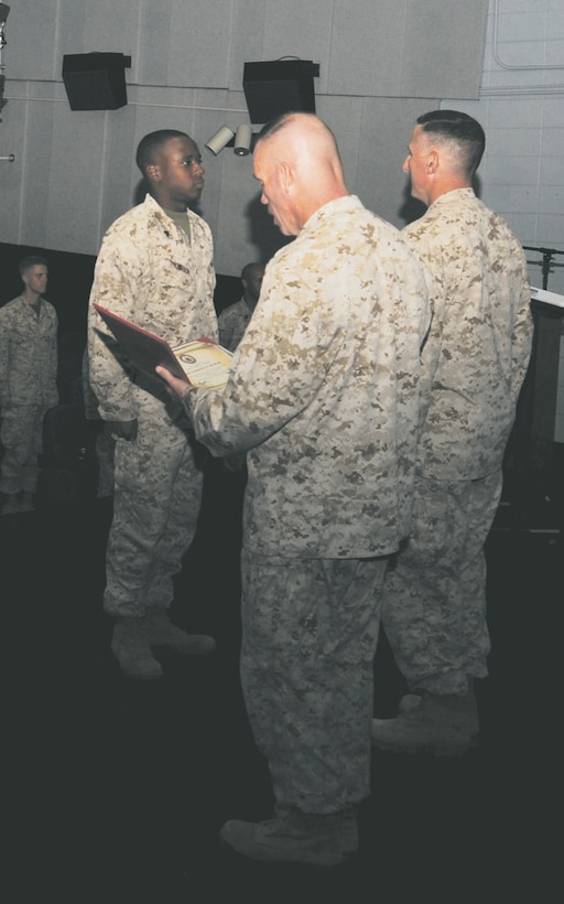 Cpl. Aspen K. Thompson, training noncommissioned officer, Marine Corps Logistics Base Albany, earns the designation “Hard Charger of the Week” during a recent ceremony held at the Base Theater.