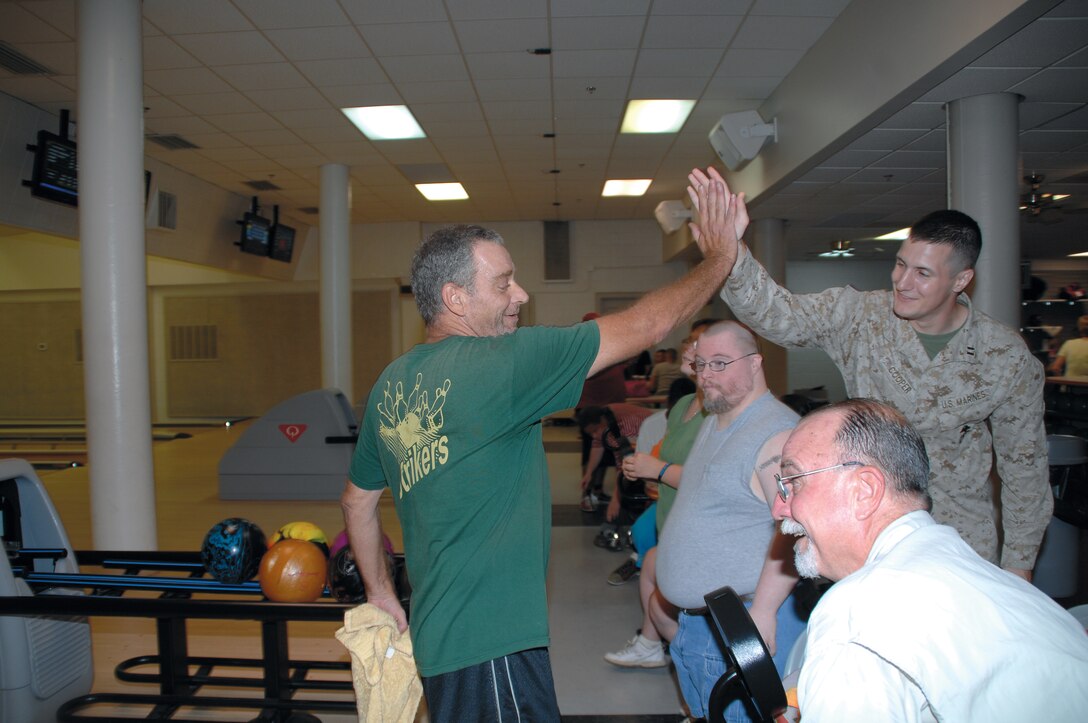 The Strikers bowling team practices for an upcoming tournament at Pin City Bowling Alley, Aug 2. The team, made up of approximately 20 Special Olympians, is preparing for the Georgia Masters Bowling Special Olympics, which will be held Aug. 24-26 in Warner Robins, Ga.