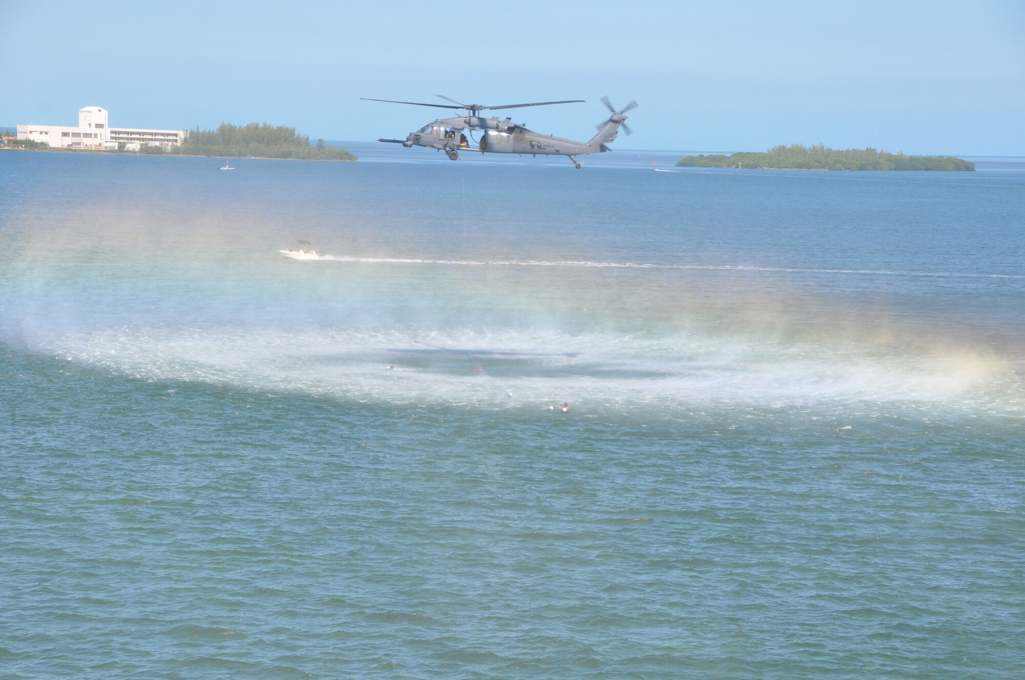 Pilots from the 457th Fighter Squadron await their turn to be hoisted up to an HH-60G Pave Hawk helicopter during water-survival training at Naval Air Station Key West, Fla., Monday, Aug. 20. The training simulated what a pilot may face should he need to be rescued after ejecting from an aircraft. The 920th Rescue Wing from Patrick Air Force Base, Fla. provided HH-60G Pave Hawk helicopters, their crew, and pararescuemen to assist with the exercise. (U.S. Air Force photo/Senior Airman Melissa Harvey)