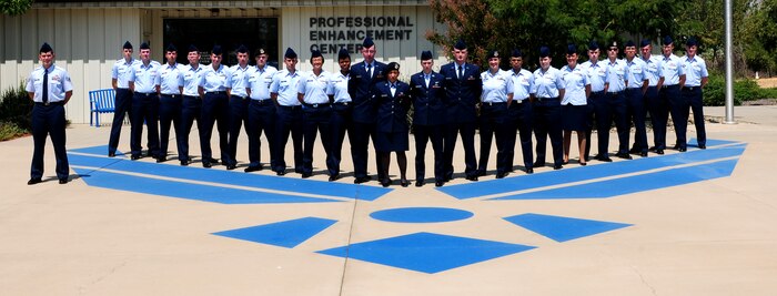 Beale?s newest members pose for their First Term Airmen Center graduation photo at the Professional Enhancement Center Beale Air Force Base Calif., August 16, 2012. FTAC provides professional military education for Airmen arriving at Beale as their first duty station. (U.S. Air Force photo by Senior Airman Allen Pollard/Released)