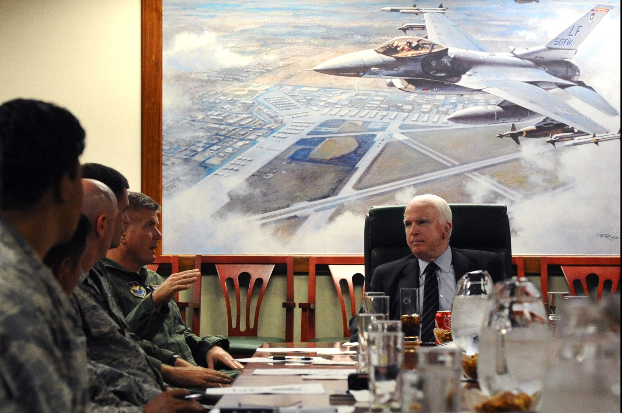 Brig. Gen. JD Harris, 56th Fighter Wing commander, speaks with Senator John McCain Aug. 23 in the wing conference room at Luke Air Force Base, Ariz. The senator visited Luke to meet with base leadership to discuss, among other things, plans to base the F-35A Lightning II at Luke. (U.S. Air Force photo by Senior Airman Sandra Welch) 