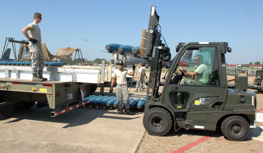 The 2nd Munitions Squadron 11-person munitions maintenance team loads 162 inert Mark 82 low drag unguided bombs on Barksdale Air Force Base, La., Aug 20. The team will compete in the 2012 Global Strike Challenge against other bases within the Air Force Global Strike Command to defend Barksdale's title of being the best in AFGSC. (U.S. Air Force photo/Staff Sgt. Jason McCasland)(RELEASED)