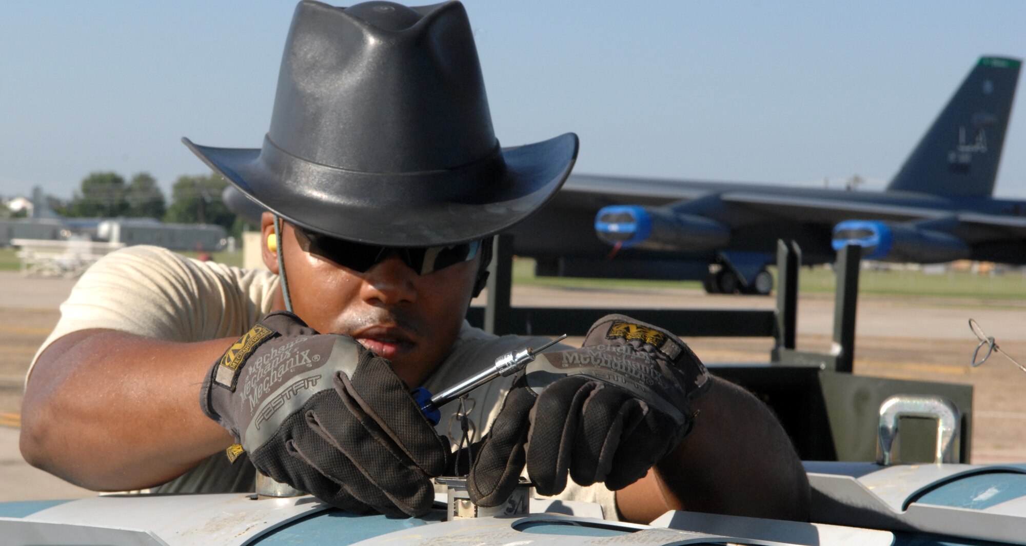 Staff Sgt. Jason Nelson, 2nd Munitions Squadron munitions maintenance team, installs an inert fuse on a two-thousand pound GPS guided GBU-31 version one bomb on Barksdale Air Force Base, La., Aug 20. The fuse installation is part of the 2012 Global Strike Challenge 11-person munitions maintenance team competition. (U.S. Air Force photo/Staff Sgt. Jason McCasland)(RELEASED)

