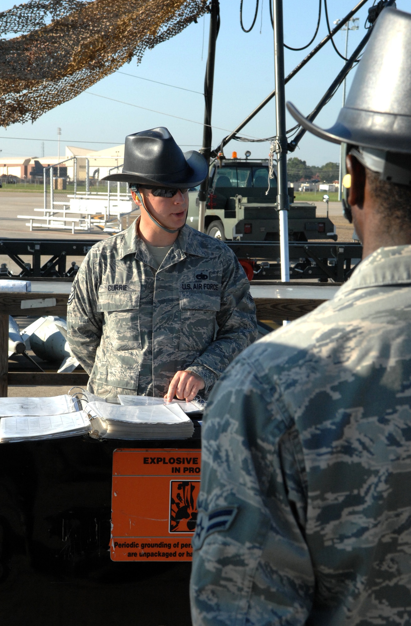 Tech. Sgt. Frederic Currie, 2nd Munitions Squadron, gives a pre-task safety brief to the 2012 Global Strike Challenge munitions maintenance team on Barksdale Air Force Base, La., Aug 20. The safety brief assigns individuals of the 11-person team to specific duties and what they should do if an emergency arises. (U.S. Air Force photo/Staff Sgt. Jason McCasland)(RELEASED)

