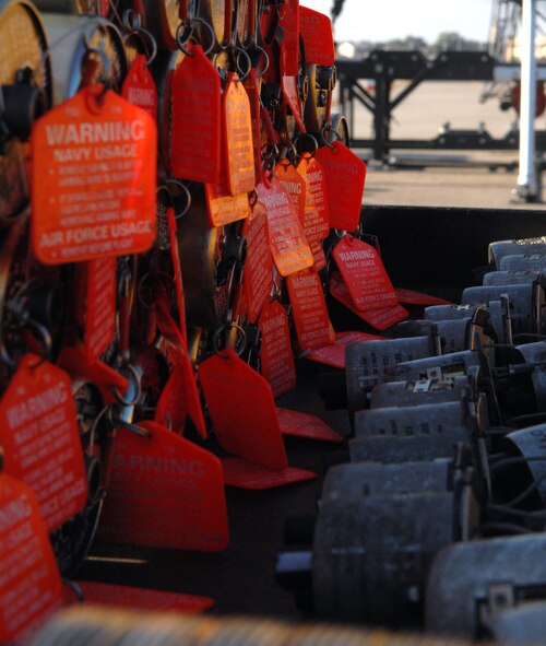 Inert FMU-152 fuses sit on a cart waiting to be installed on the GBU-31 version one and the GBU-31 version three bombs on Barksdale Air Force Base, La., Aug 20. The 11-person team competes against the other bases within Air Force Global Strike Command to defend Barksdale's title of the best munitions maintenance team in AFGSC. (U.S. Air Force photo/Staff Sgt. Jason McCasland)(RELEASED)