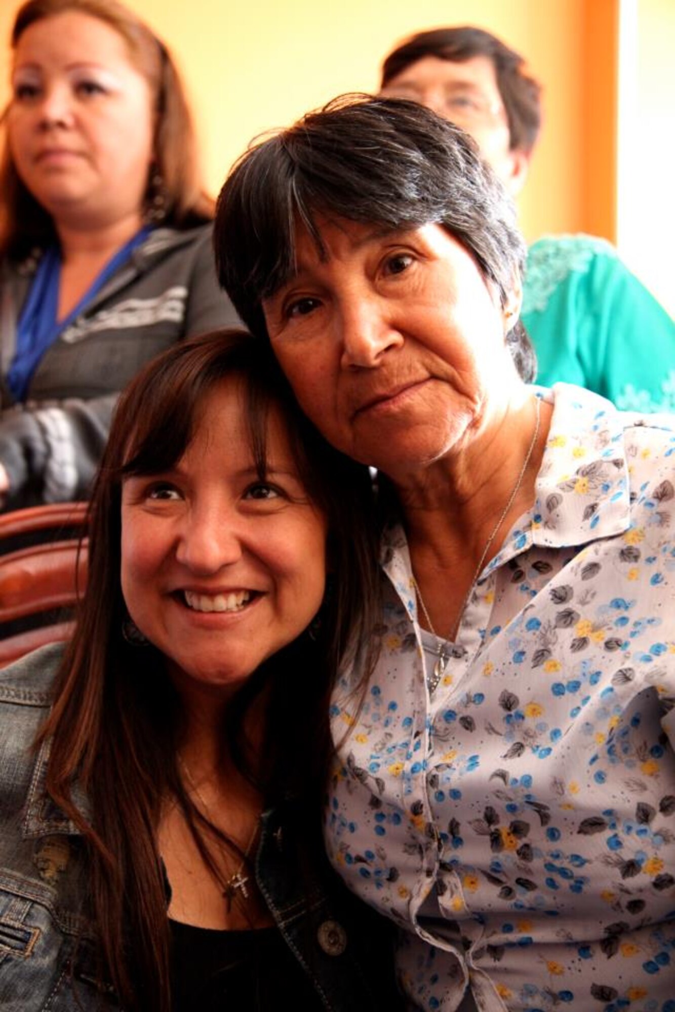 Master Sgt. Nicole Culverhouse, left, hugs her mother recently in Bogota, Colombia, during their first meeting since her kidnapping 36 years ago.