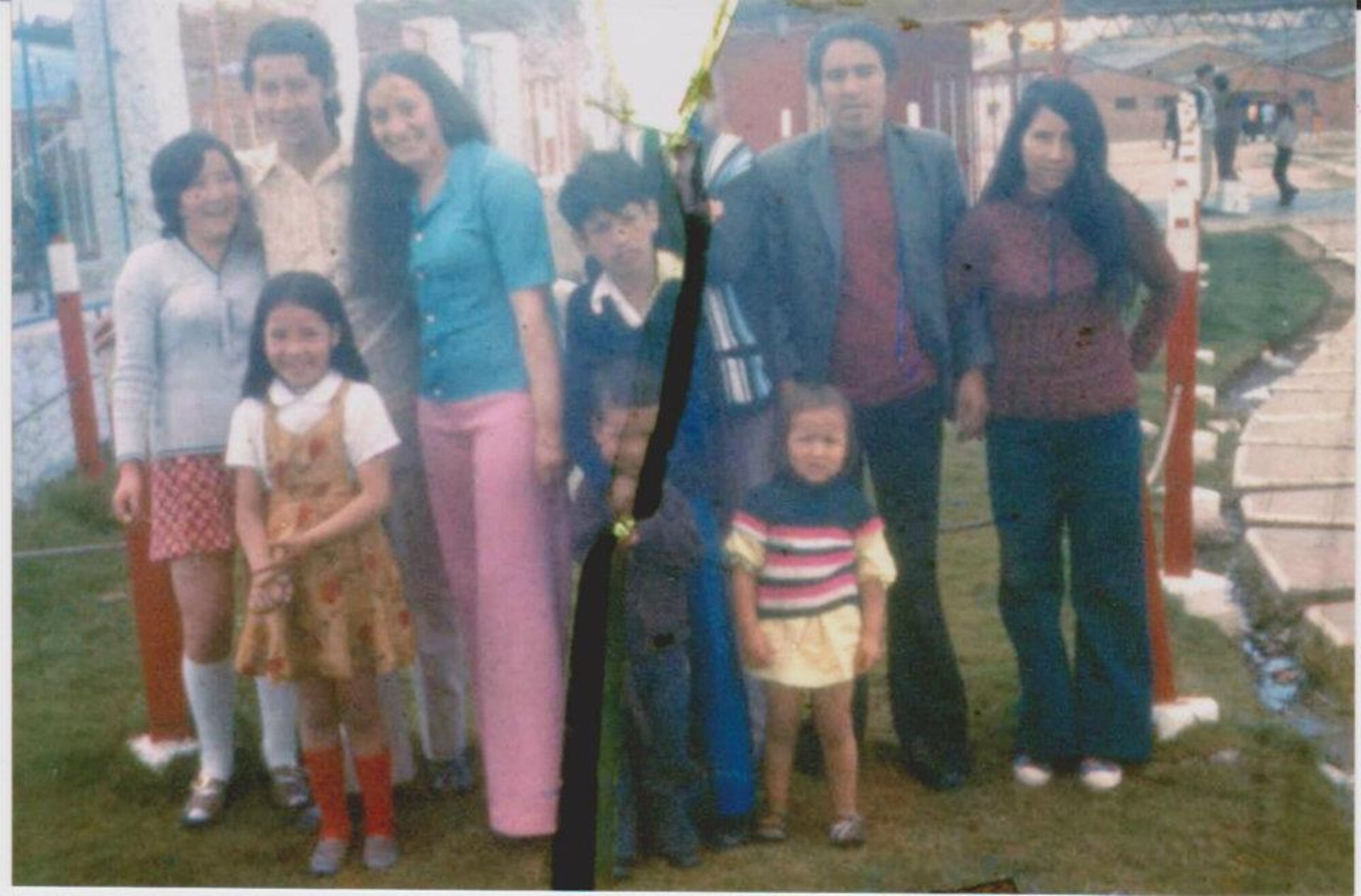 Master Sgt. Nicole Culverhouse, front, in striped shirt, is seen as a little girl with her family in Bogota, Colombia, shortly before she was kidnapped. After being adopted by an American family, she recently reunited with her birth family after 36 years.