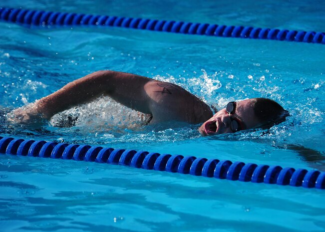 An Airman swims 400 meters in the main base pool during the Recce Challenge Sprint Triathlon August 23, 2012 at Beale Air Force Base, Calif. 57 members of Team Beale participated in the triathlon. (U.S. Air Force photo by Senior Airman Shawn Nickel/Released)