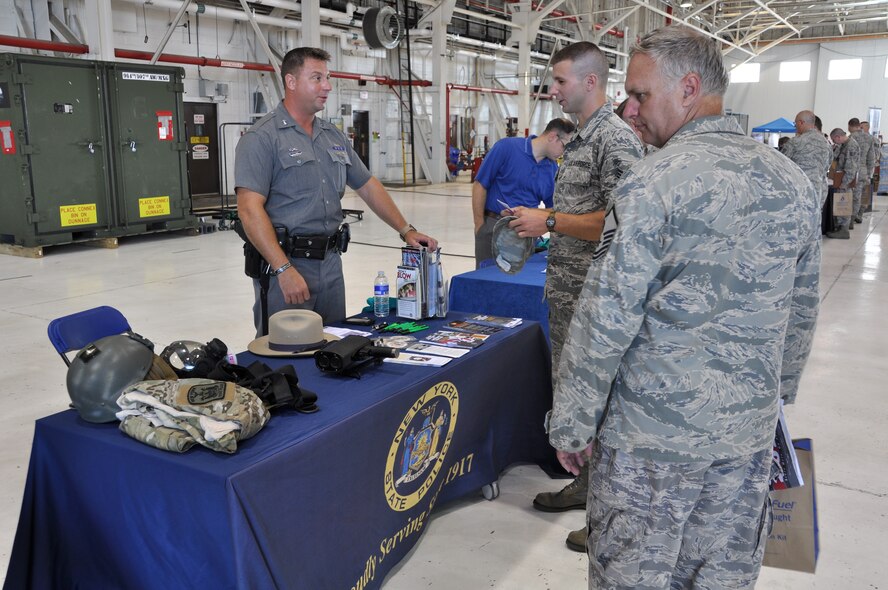 NIAGARA FALLS AIR RESERVE STATION, N.Y. - A job and resource open house was held here August 4, 2012.  Many base personnel, military and civilian, along with their families were able to look over dozens of informational tables and talk with local and national employers, educational institutions, and resource organizations.  (U.S. Air Force photo by Master Sgt. Kevin Nichols)