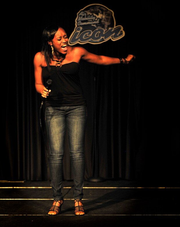 First Lt. Nicole White, assigned to Air Mobility Command public affairs, sings the song “Sweet Thing” by Chaka Khan winning her the first place title in the 2012 Scott Air Force Base AMC Icon contest Aug, 23. White will represent Scott in the AMC Icon finals taking place in October 25, 2012. (U.S. Air Force photos/ Staff Sgt. Stephenie Wade)