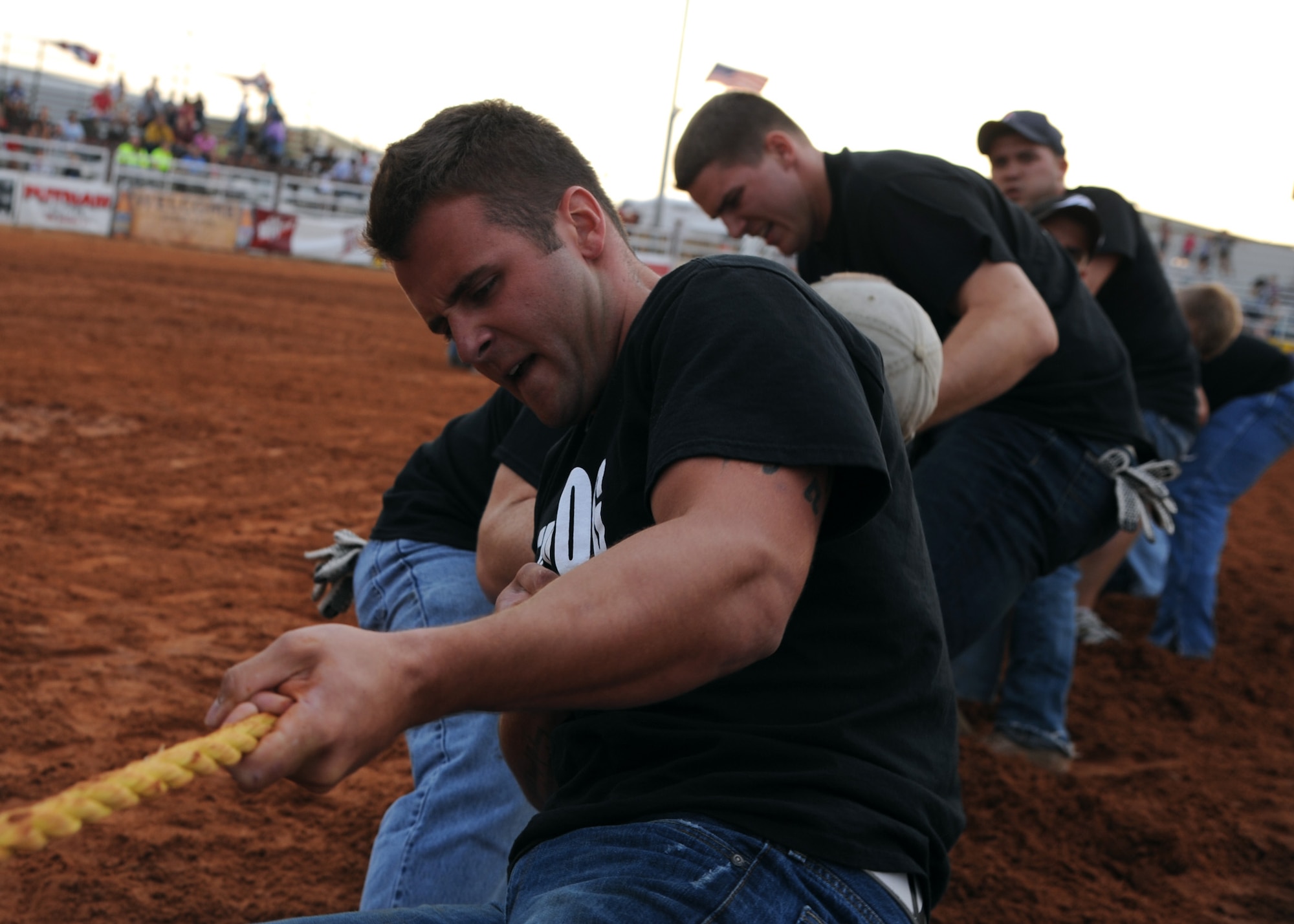 ALTUS AIR FORCE BASE, Okla. – The 97th Security Forces team competes in a tug of war competition during Military Appreciation Night at the Great Plains Stampede Rodeo grounds, Aug. 23, 2012. The tug of war competition was one of the events during Military Appreciation Night where the 97th Security Forces Squadron defeated the 97th Training Squadron and 58th Airlift Squadron teams.  (U.S. Air Force photo by Airman 1st Class Klynne Pearl Serrano / 97th Air Mobility Wing / Released)
