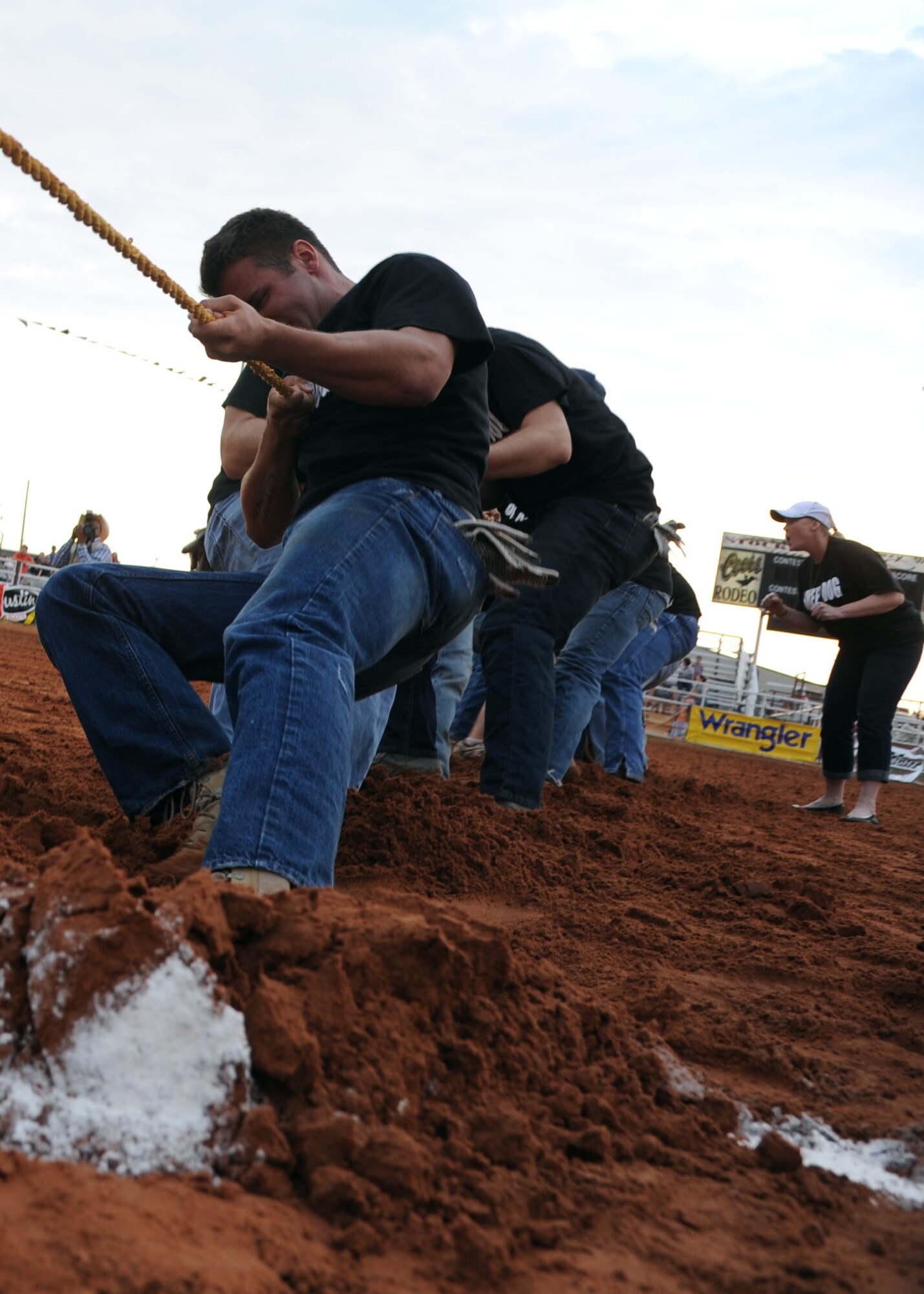 ALTUS AIR FORCE BASE, Okla. – The 97th Security Forces team competes in a tug of war competition during Military Appreciation Night at the Great Plains Stampede Rodeo grounds, Aug. 23, 2012. The tug of war competition was one of the events during Military Appreciation Night where the 97th Security Forces Squadron defeated the 97th Training Squadron and 58th Airlift Squadron teams.  (U.S. Air Force photo by Airman 1st Class Klynne Pearl Serrano / 97th Air Mobility Wing / Released)