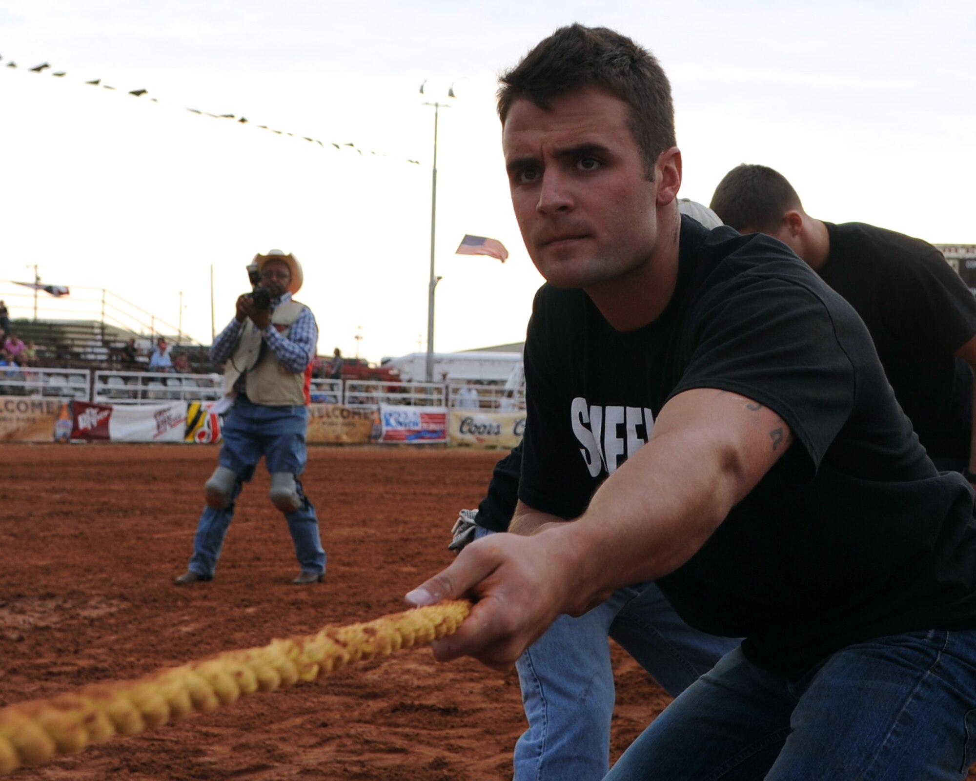 ALTUS AIR FORCE BASE, Okla. – Senior Airman Joshua Sams, 97th Security Forces Squadron unit trainer, prepares for a tug of war competition during Military Appreciation Night at the Great Plains Stampede Rodeo grounds, Aug. 23, 2012. The tug of war competition was one of the events during Military Appreciation Night where the 97th Security Forces Squadron defeated the 97th Training Squadron and 58th Airlift Squadron teams.  (U.S. Air Force photo by Airman 1st Class Klynne Pearl Serrano / 97th Air Mobility Wing / Released)