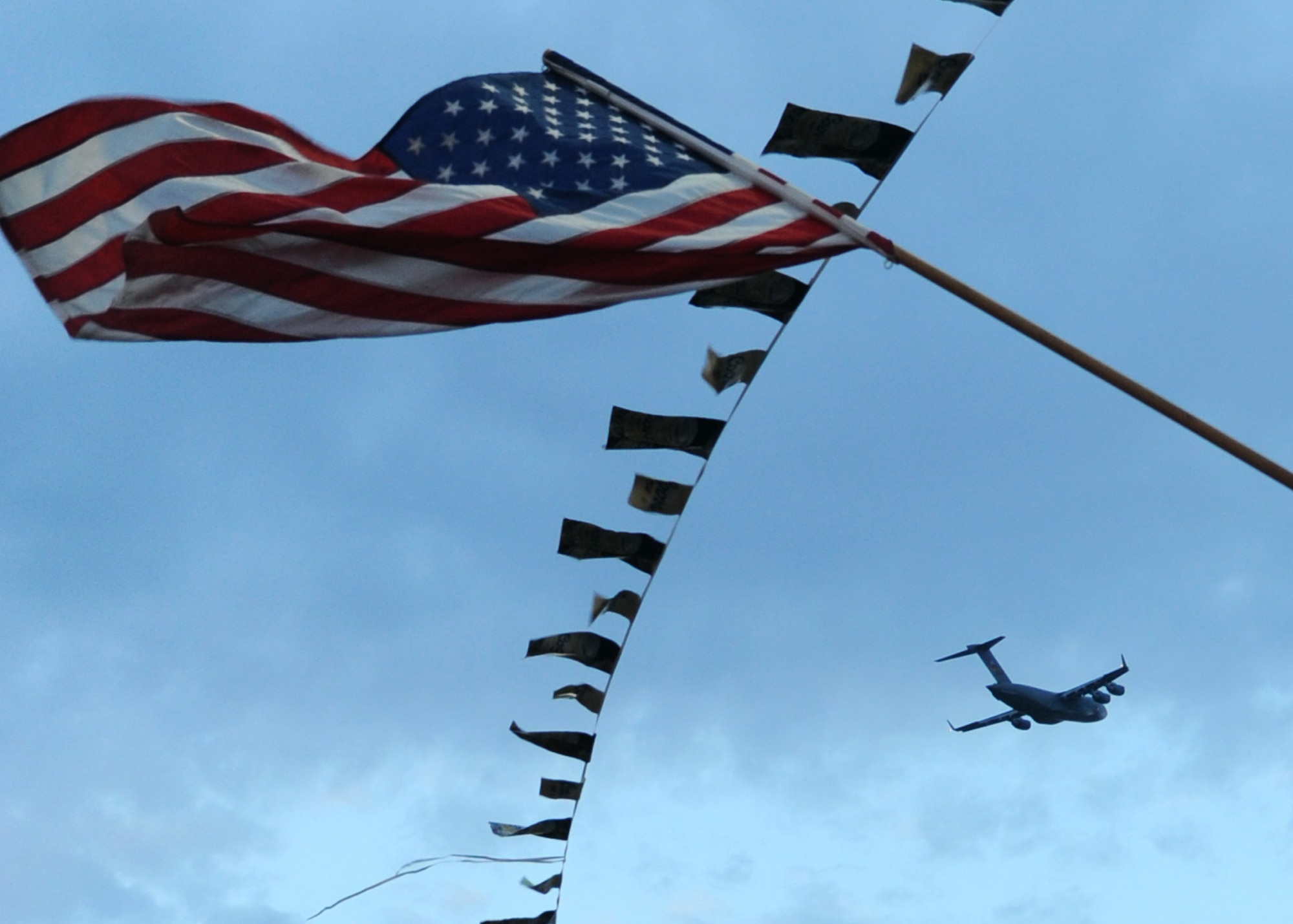 ALTUS AIR FORCE BASE, Okla. – A C-17 Globemaster III flies over the Great Plains Stampede Rodeo grounds during Military Appreciation Night, Aug. 23, 2012. Military Appreciation Night is one event held during the Great Plains Stampede Rodeo in Altus. (U.S. Air Force photo by Airman 1st Class Klynne Pearl Serrano / 97th Air Mobility Wing / Released)