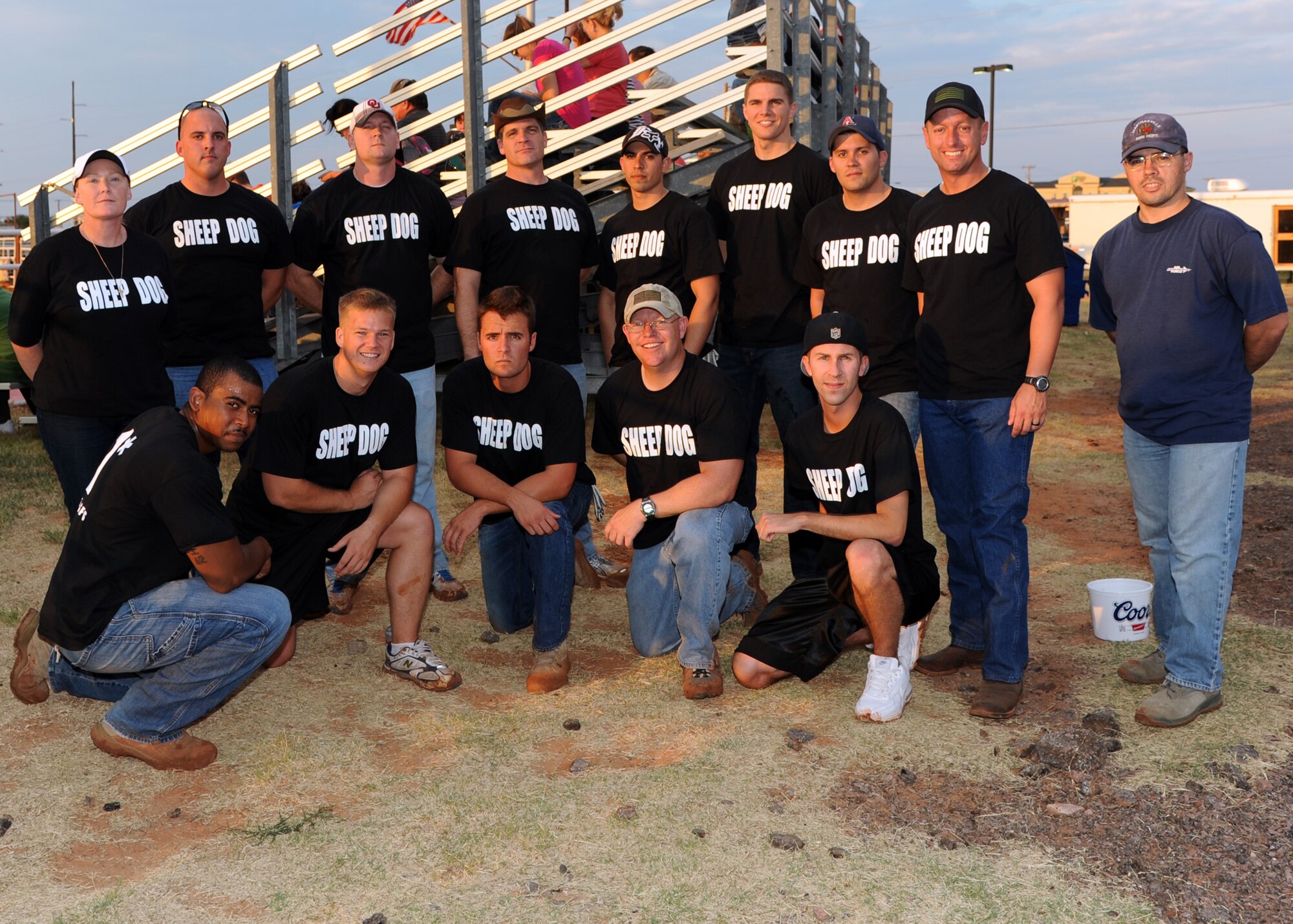 ALTUS AIR FORCE BASE, Okla. – The 97th Security Forces Squadron tug of war team poses for a photo after winning the tug of war competition during Military Appreciation Night at the Rodeo grounds, Aug. 23, 2012. The 97th SFS team defeated the 97th Training Squadron and 58th Airlift Squadron teams. (U.S. Air Force photo by Airman 1st Class Klynne Pearl Serrano / 97th Air Mobility Wing / Released)