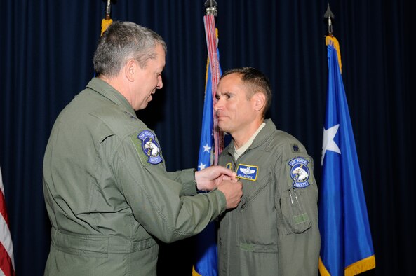 Maj. Gen. Greg Feest, Air Force Chief of Safety, presents the Bronze Star Medal to Lt. Col. William D. Neitzke for meritorious achievements during a year-long deployment in support of Operation New Dawn and follow-on activities. (U.S. Air Force photo by Keith Wright)