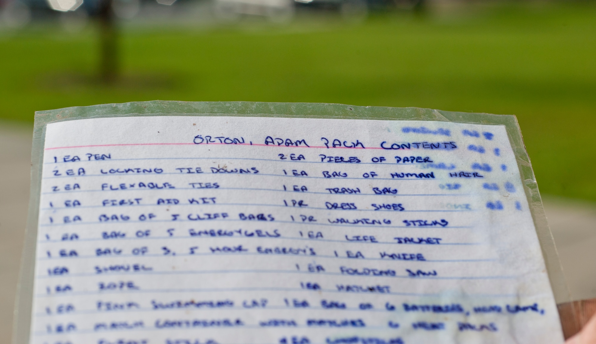 Airman 1st Class Adam Orton holds his inventory list from the 2012 Spartan Death Race, Aug. 9, 2012 at Moody Air Force Base, Ga. The competitors were required to write everything in their pack on an index card. Today, Orton keeps this card in his backpack for motivation. (U.S. Air Force photo/Airman 1st Class Jarrod Grammel)