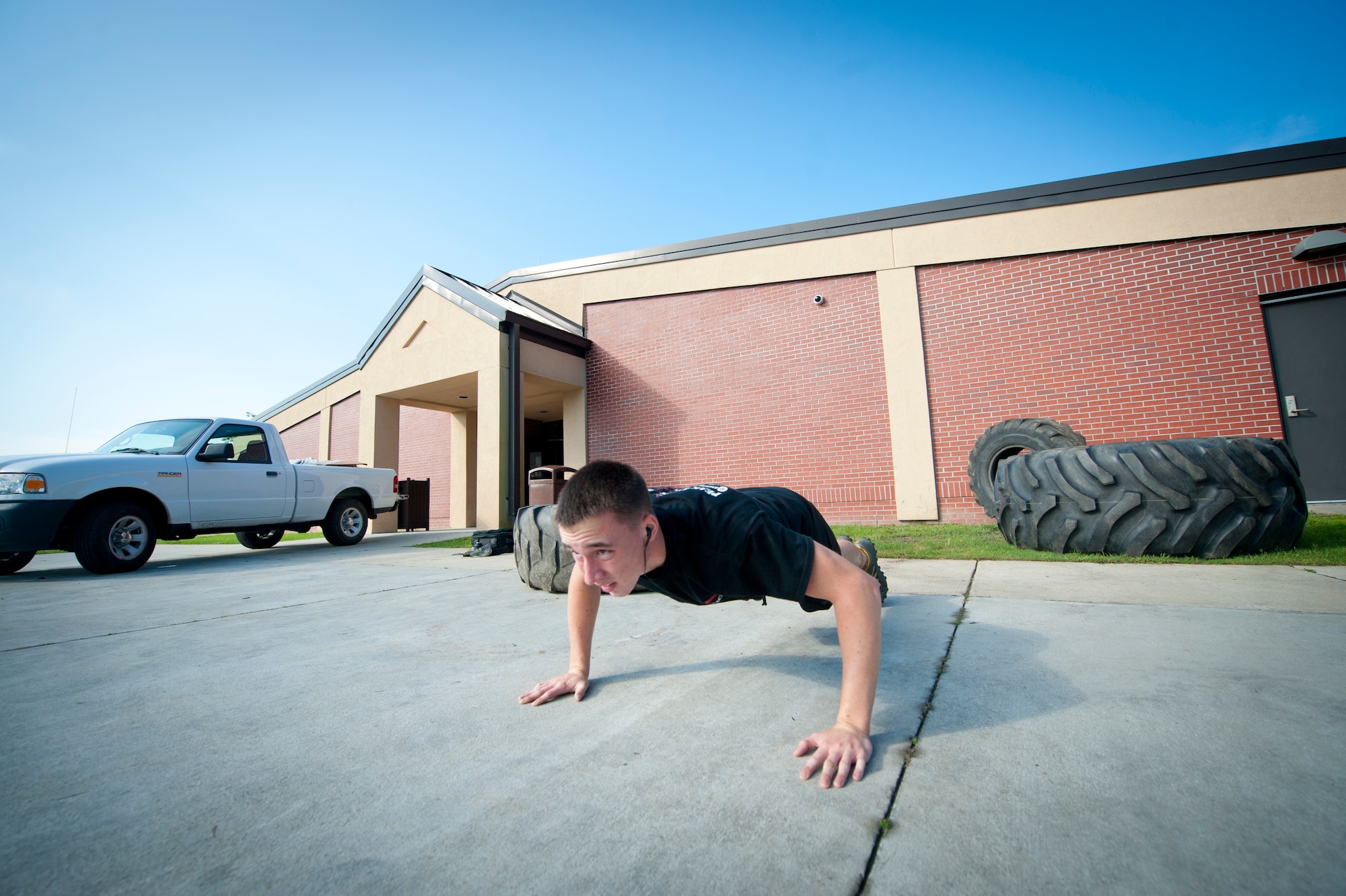 Airman 1st Class Adam Orton does pushups at Moody Air Force Base, Ga., Aug. 9, 2012. Orton works out five to six days a week on cardio and strength training. Orton is a 74th Aircraft Maintenance Unit aerospace propulsion journeyman. (U.S. Air Force photo/Airman 1st Class Jarrod Grammel)