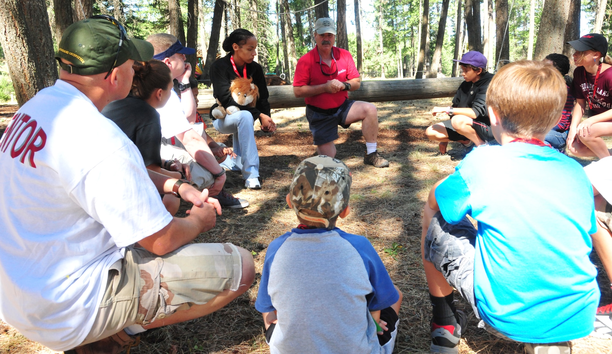 After the tight rope team challenge, Adventure Dynamics instructor Will Parks talks with members of the D.A.R.E. summer camp about making wise decisions, how to avoid peer pressure and to ‘just say no’ to drugs Aug. 22, 2012 at Adventure Dynamics in Nine Mile Falls, Washington. Adventure Dynamics is the Inland Northwest's original, outdoor experience that fosters the development and understanding of three important human skills: commitment, self-confidence and teamwork. (U.S. Air Force photo by Airman 1st Class Earlandez Young)