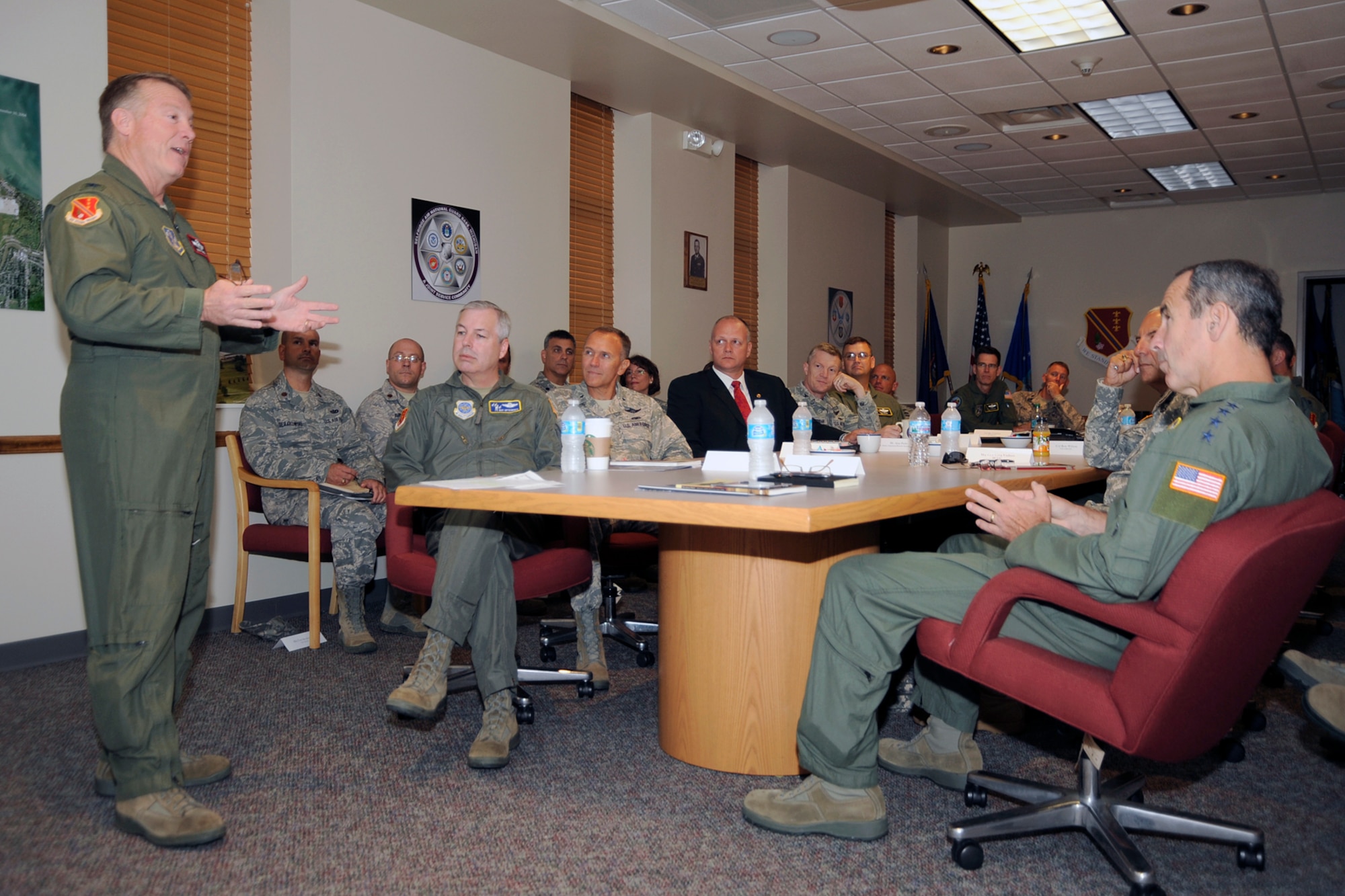 Col. Michael T. Thomas, 127th Wing commander, welcomes Gen. Raymond E. Johns, commander of Air Mobility Command, to Selfridge Air National Guard Base, Mich., Aug. 24, 2012, prior to a base briefing. Also in attendance are Brig. Gen. Roy Uptegraff, Air National Guard liaison to Air Mobility Command, Brig. Gen. James Wilson, Michigan Adjutant General for Air-Future Missions, and Maj. Gen. Greg Vadnais, Michigan Adjutant General. The Selfridge leaders presented their case to Gen. Johns for locating new platforms at the Michigan base. (Air National Guard photo by John S. Swanson)