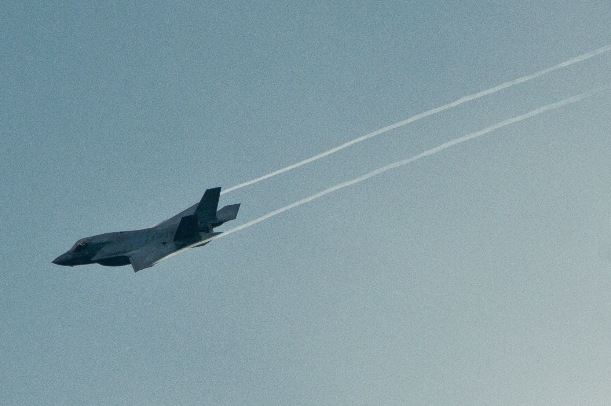 An F-35 Lightning II joint strike fighter streaks across the sky over Eglin Air Force Base, Fla., Aug. 22.  The aircraft performed three approaches to the runway before returning to the 33rd Fighter Wing.  (U.S. Air Force photo/Samuel King Jr.)