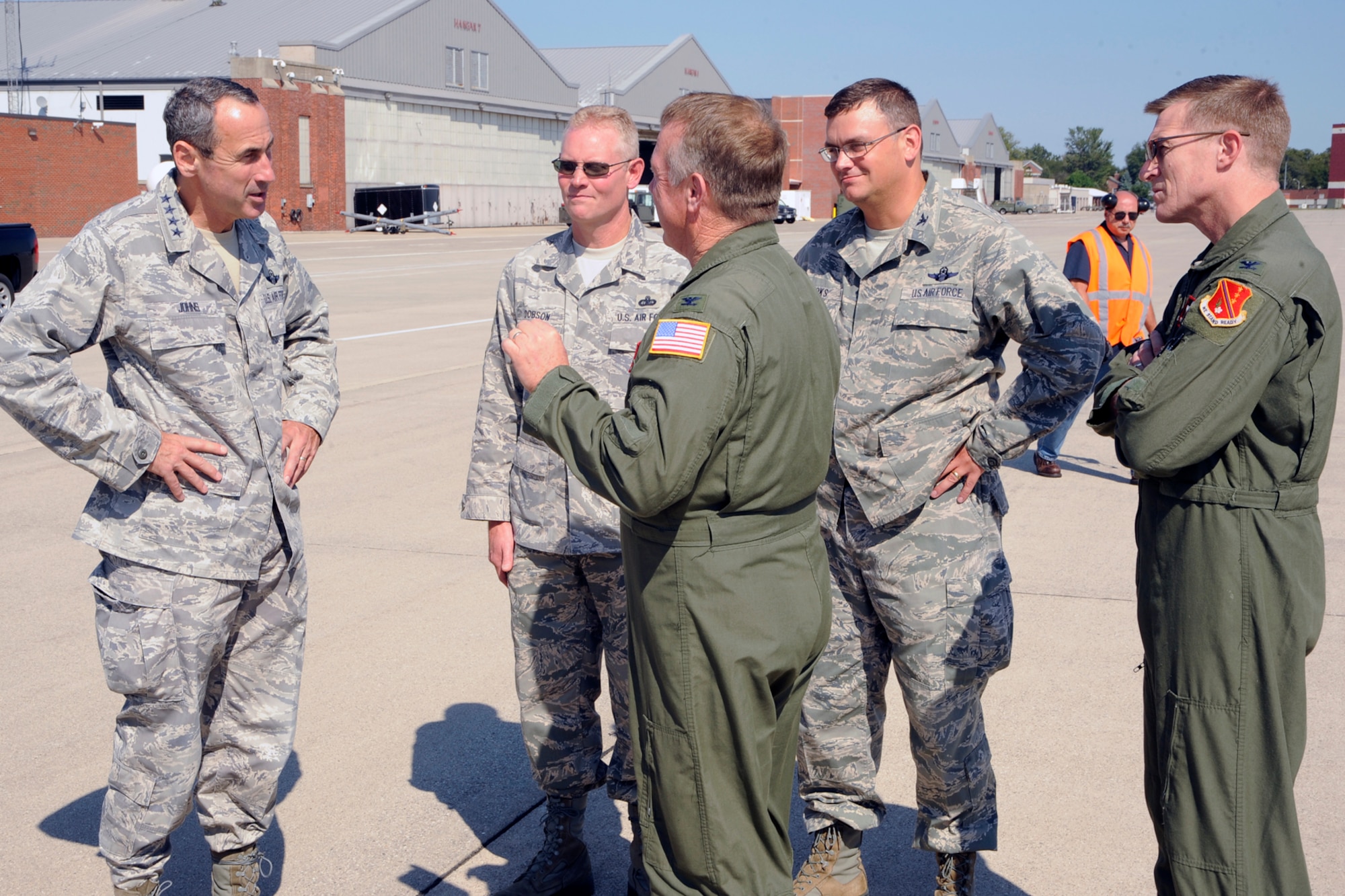 Senior members of the 127th Wing welcome Gen. Raymond E. Johns, commander of Air Mobility Command to Selfridge Air National Guard Base, Mich., Aug. 23, 2012. The Selfridge leaders presented their case to Johns for locating possible future aircraft missions at the Michigan base. Greeting the general are CMSgt. Robert Dobson, 127th Wing command chief; Col. David Brooks, 127th Air Refueling Group commander; Col. Philip Sheridan, 127th Wing vice commander; and Col. Michael Thomas, 127th Wing commander. (Air National
Guard photo by John S. Swanson)
