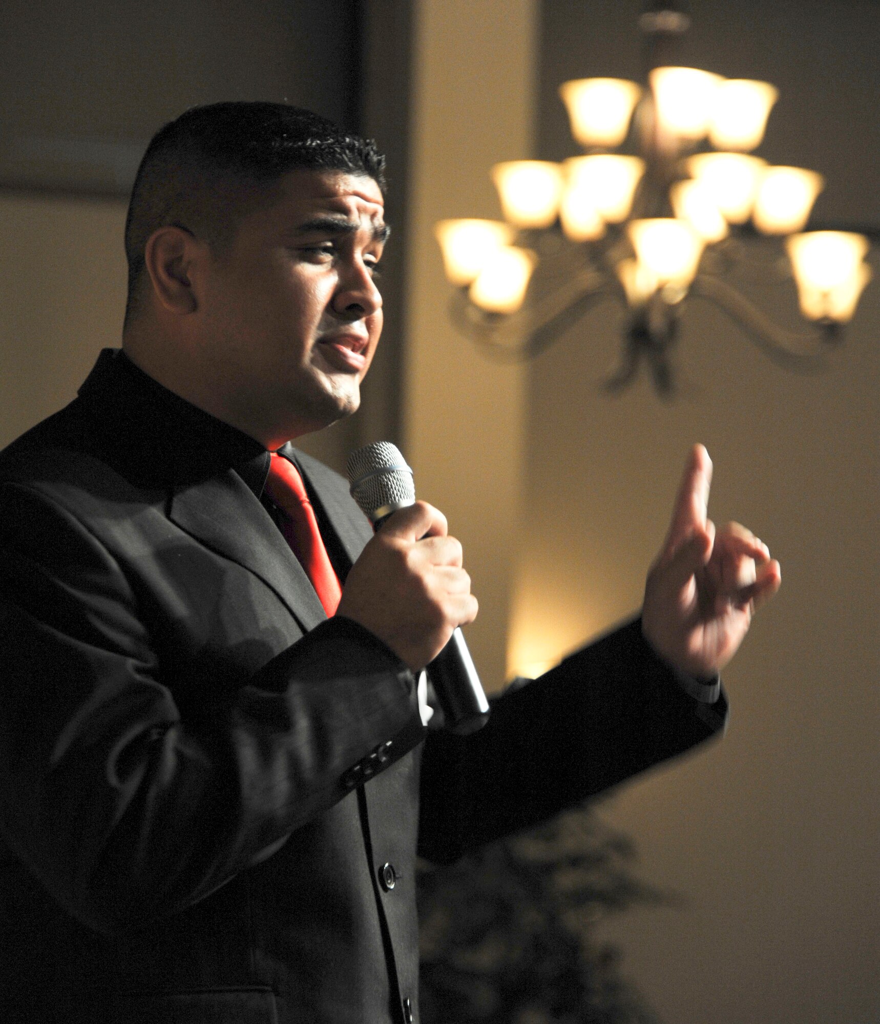Senior Airman Benjamin Florez, a ramp specialist or "port dawg" with the 305th Aerial Port Squadron, originally from El Paso, Texas, sings "If I ain't got you" during the AMC Icon singing competition held at Tommy B's Community Activities Center Aug. 16. Although Florez took second place, earning $300, he will be heading to the next stage of competition at Scott Air Force Base, Ill., because he is active duty Air Force and first place went to a dependent. (U.S. Air Force photo by 2nd Lt. David J. Murphy/Released)