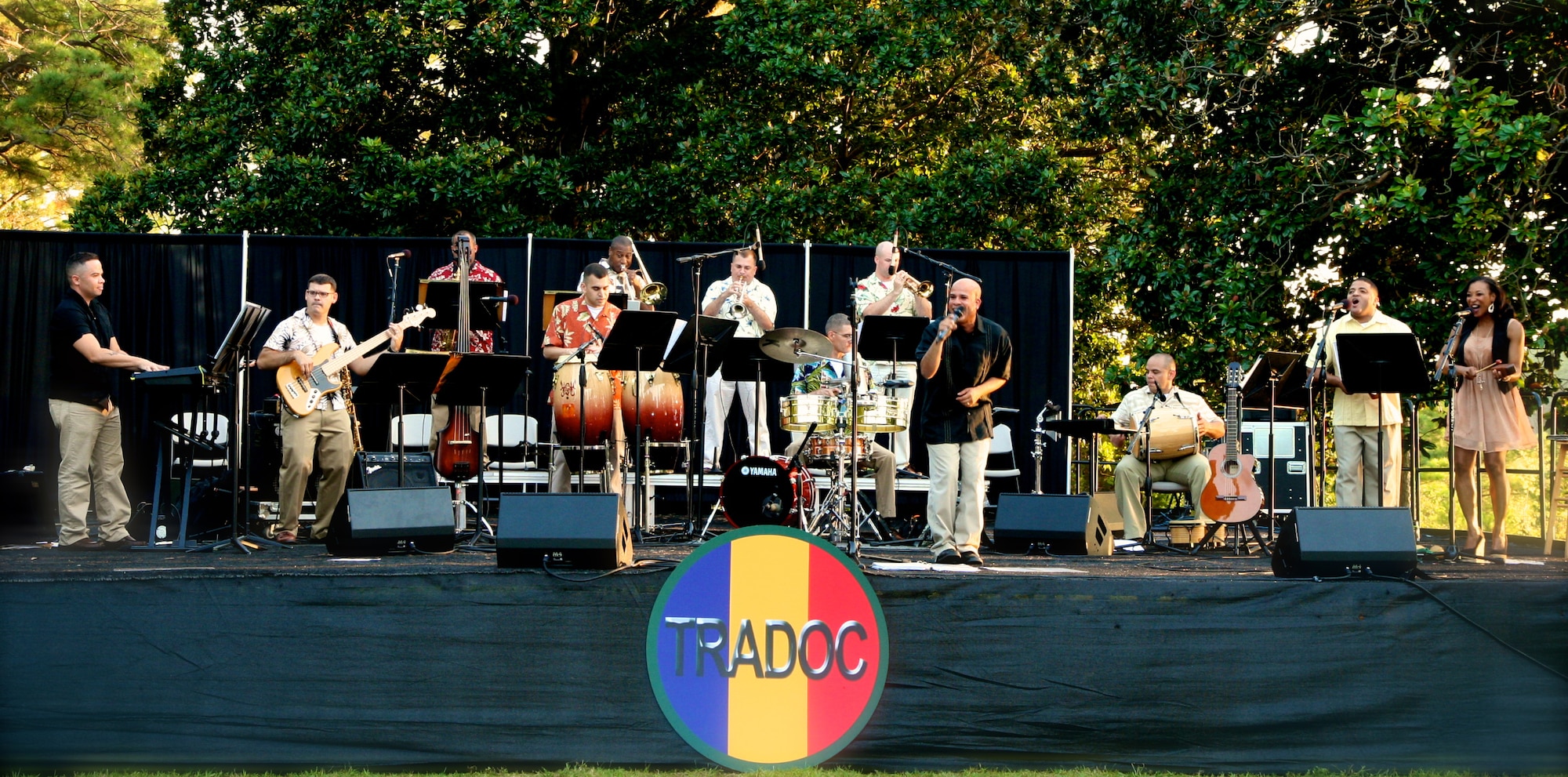 The U.S. Army Training and Doctrine Command Band’s Salsa ensemble, Bahía Caliente, performs for audience of more than 200 people at Magnolia Park, Fort Eustis, Va., Aug. 16, 2012. The concert, titled “Tropical Rhythm”, continued the band’s Music Under the Stars summer series, now in its 80th season. (U.S. Army photo by Staff Sgt. James Cipriano/Released)