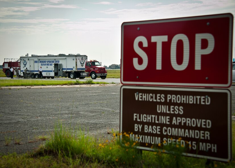 Members of the 96th Test Wing fire department set up the mobile emergency operations center during a Nuclear Accident Response Exercise at Eglin Air Force Base, Fla., Aug. 22.  Eglin agencies, including first responders, were evaluated on their reactions and responses to a vehicle explosion carrying nuclear material.  (U.S. Air Force photo/Samuel King Jr.)