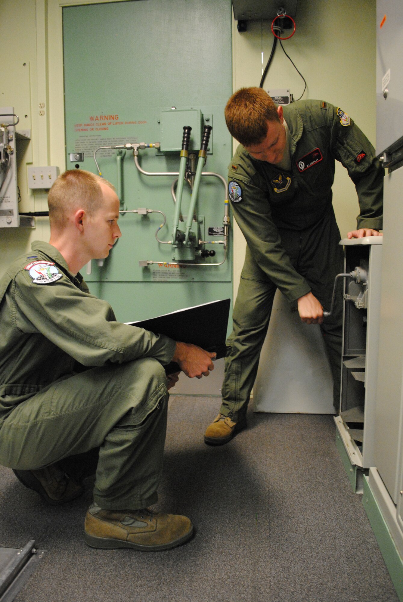 The 12th Missile Squadron selected 1st Lt. Chris McCollum, missile combat crew commander, left, and 2nd Lt. Ronald Grimley, deputy missile combat crew commander, to represent them Sept. 9 to 13 during the operations portion of the annual Global Strike Challenge competition set to take place here at Malmstrom.  (U.S. Air Force photo/Airman 1st Class Katrina Heikkinen)