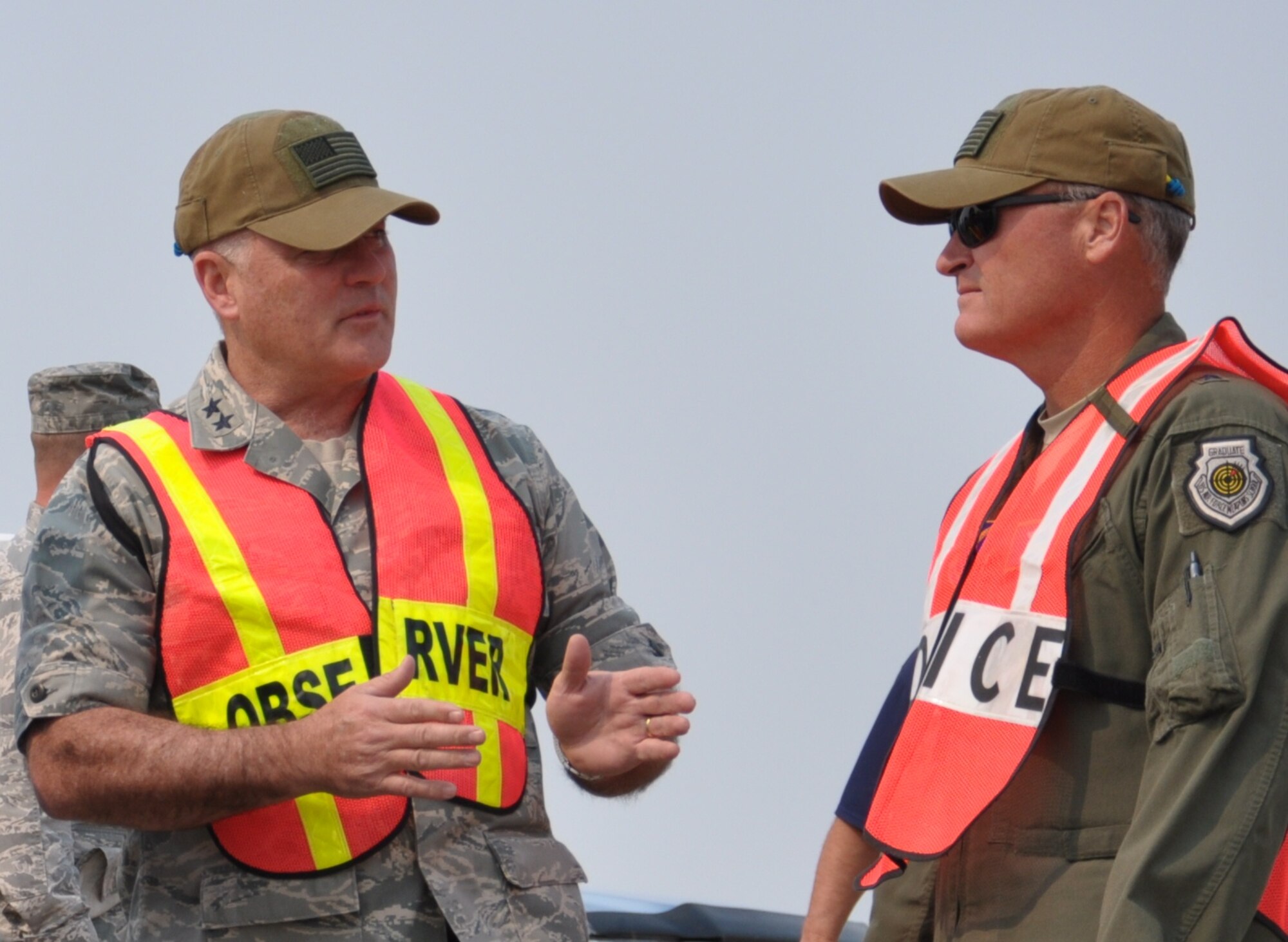Maj. Gen. Michael J. Carey, 20th Air Force commander, discusses helicopter operations with Brig. Gen. James Browne, Air Force Global Strike Command director of operations, during a visit to the 620th Ground Combat Training Squadron at Camp Guernsey, Wyo., Aug. 15. During his visit, Browne had the
opportunity to view helicopter operations, as they pertain to the sustainment of nuclear security, and the unique strengths they bring to the fight. (U.S. Air Force photo by Staff Sgt. Torri Savarese)
