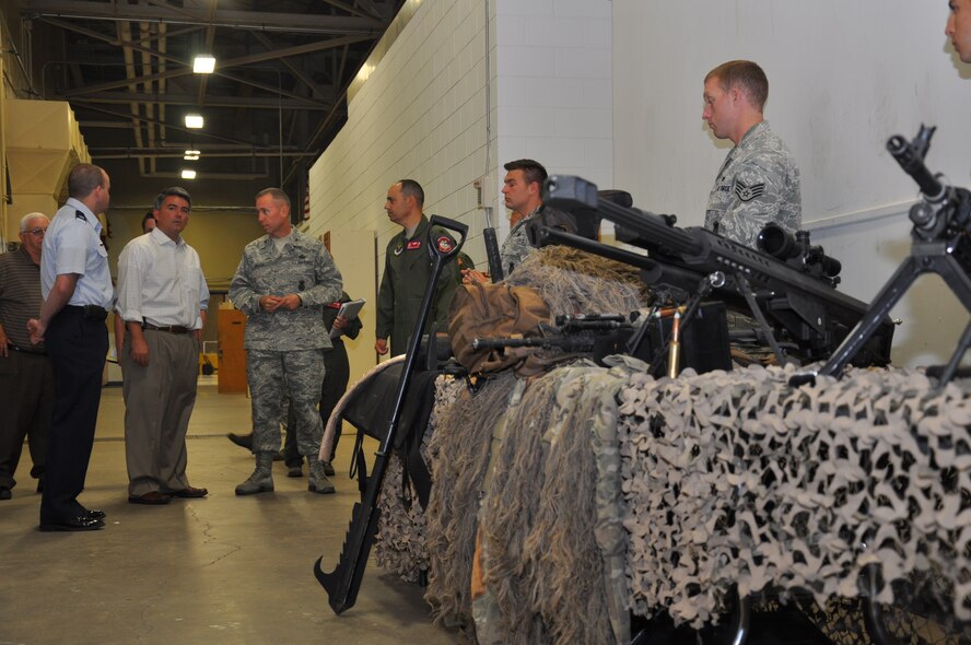 U.S. Representative Cory Gardner, 4th District of Colo.; Col. George Farfour, 90th Missile Wing vice commander;  Col. Tom Wilcox, 90th Security Forces Group commander; and Capt. Joseph Merrill, 90th SFG tactical response force, go over the mission of the TRF during Gardner’s tour of the Mighty Ninety Aug. 20. (U.S. Air Force photo by Senior Airman Dan Gage)