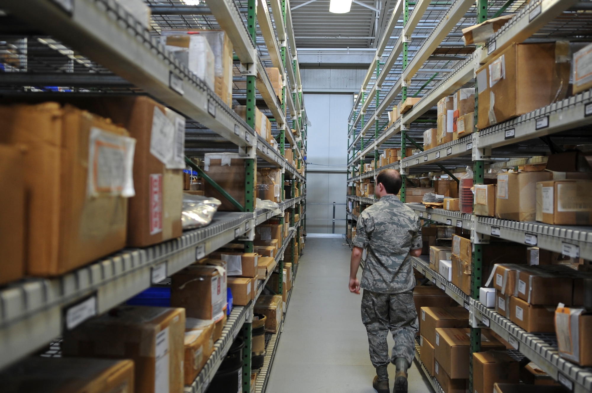 U.S. Air Force Airman 1st Class Jacob Malone, 23d Logistics Readiness Squadron aircraft part store journeyman, checks shelves for an aircraft part at Moody Air Force Base, Ga., Aug. 22, 2012. The parts are used by maintainers to replace broken parts on HC-130P Combat Kings and HH-60G Pave Hawks. (U.S. Air Force photo by Airman 1st Class Olivia Dominique/Released)