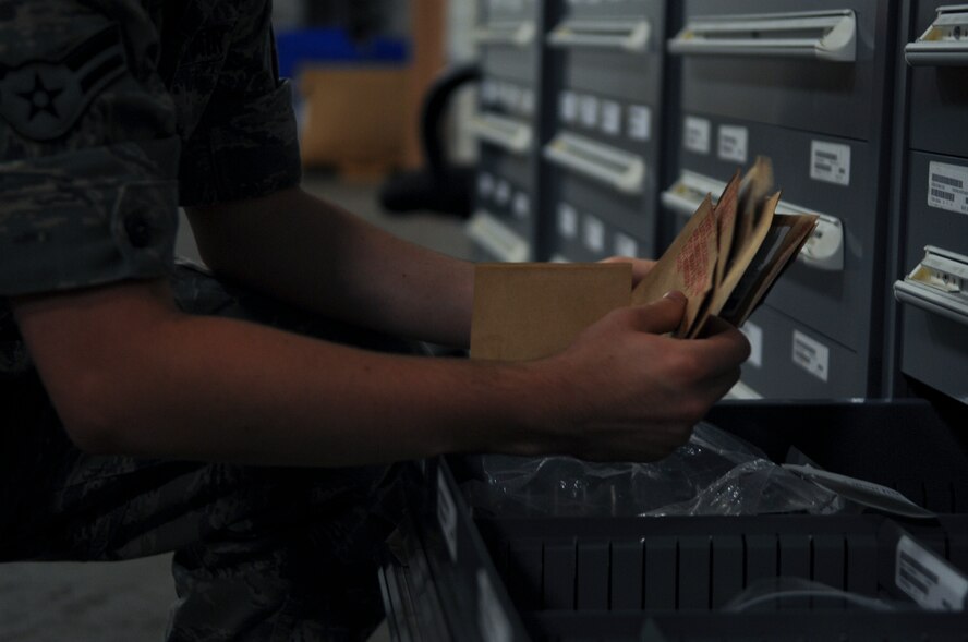U.S. Air Force Airman 1st Class Jacob Malone, 23d Logistics Readiness Squadron aircraft part store journeyman, sorts through aircraft parts at Moody Air Force Base, Ga., Aug. 22, 2012. Each aircraft part is assigned a location in the shop for efficiency and easy access to retrieve for customers. (U.S. Air Force photo by Airman 1st Class Olivia Dominique/Released)