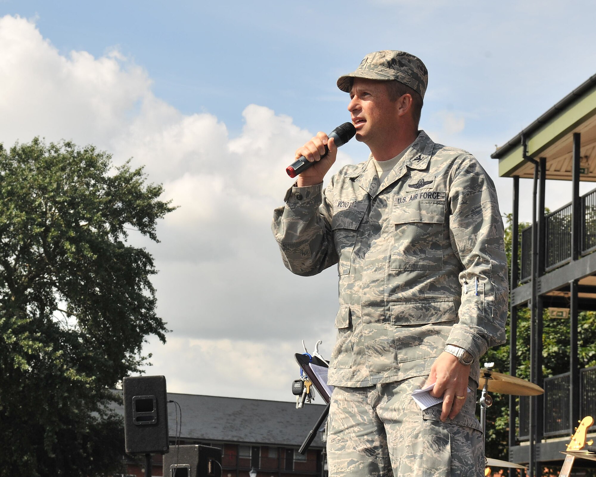 RAF MILDENHALL, England – Col. Kyle Voigt, 100th Air Refueling Wing vice commander, makes opening remarks at the Unaccompanied Airman Appreciation Day Aug. 23, 2012, in the Bob Hope Community Center parking lot. The event was sponsored by several base organizations and clubs and was open to all unaccompanied Airmen assigned to Team Mildenhall. (U.S. Air Force photo/Senior Airman Jerilyn Quintanilla)