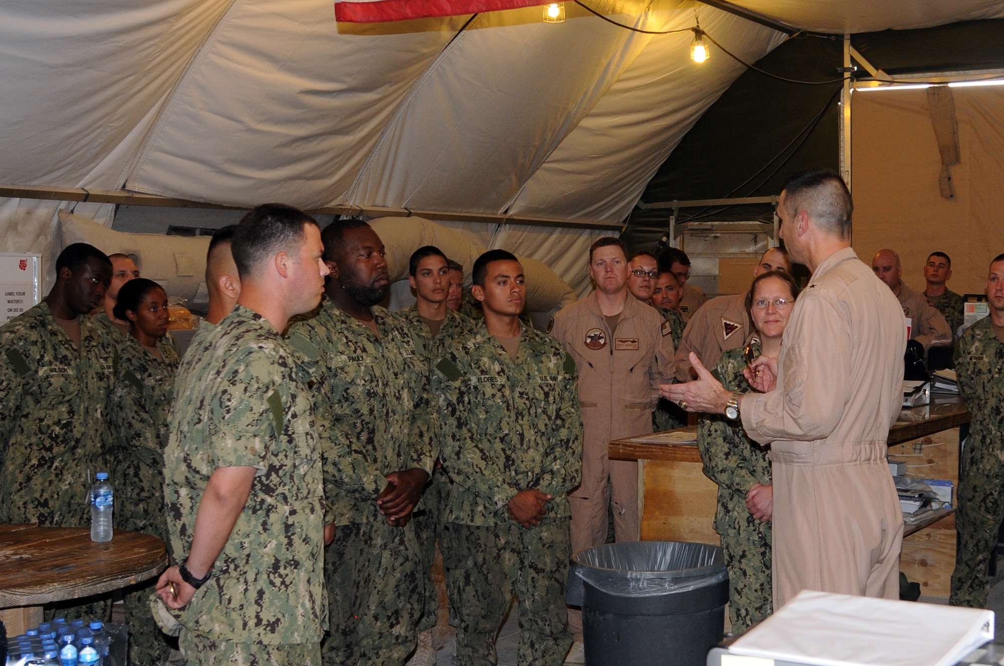 U.S. Navy Rear Admiral Matthew Carter, Patrol and Reconnaissance Force Fifth/Seventh Fleet commander, discusses current mission requirements and how CTG 57.1 supports these requirements. The sailors are assigned to CTG 57.1 as part of VQ-1. They are based at the 379th Air Expeditionary Wing in Southwest Asia, August 15, 2012. The primary mission of CTG 57.2 is to conduct reconnaissance and maritime patrol operations throughout the 5th Fleet Area of Responsibility in support of the global war on terrorism. (U.S. Air Force photo/Captain Craig Carper)