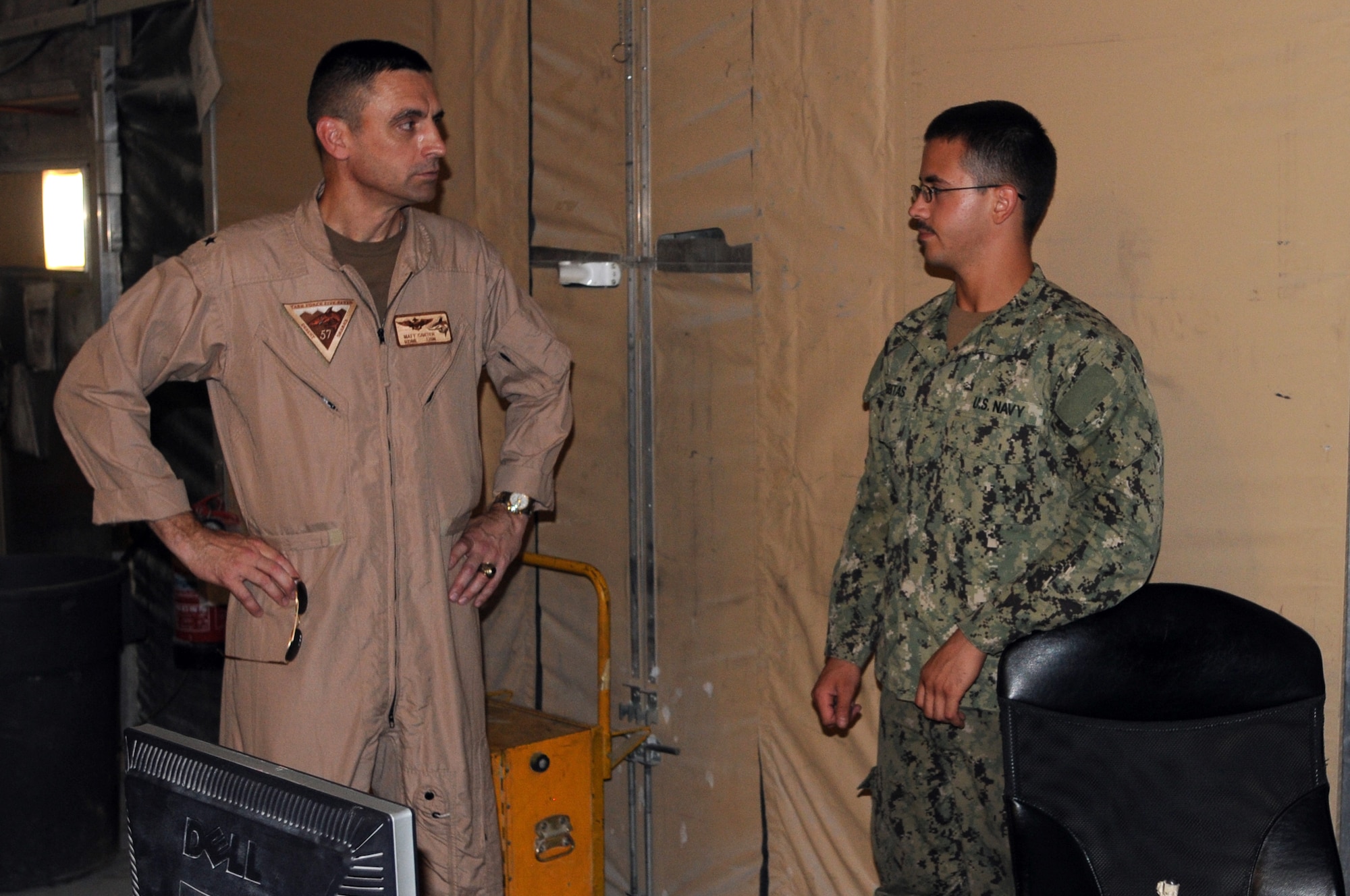 U.S. Navy Rear Admiral Matthew Carter, Patrol and Reconnaissance Force Fifth/Seventh Fleet commander, talks to Aviation Machinist?s Mate Airman Nathan Tabbitas is assigned to CTG 57.2 as part of VP-46. They are based at the 379th Air Expeditionary Wing in Southwest Asia, August 15, 2012. The primary mission of CTG 57.2 is to conduct reconnaissance and maritime patrol operations throughout the 5th Fleet Area of Responsibility in support of the global war on terrorism. (U.S. Air Force photo/Captain Craig Carper)