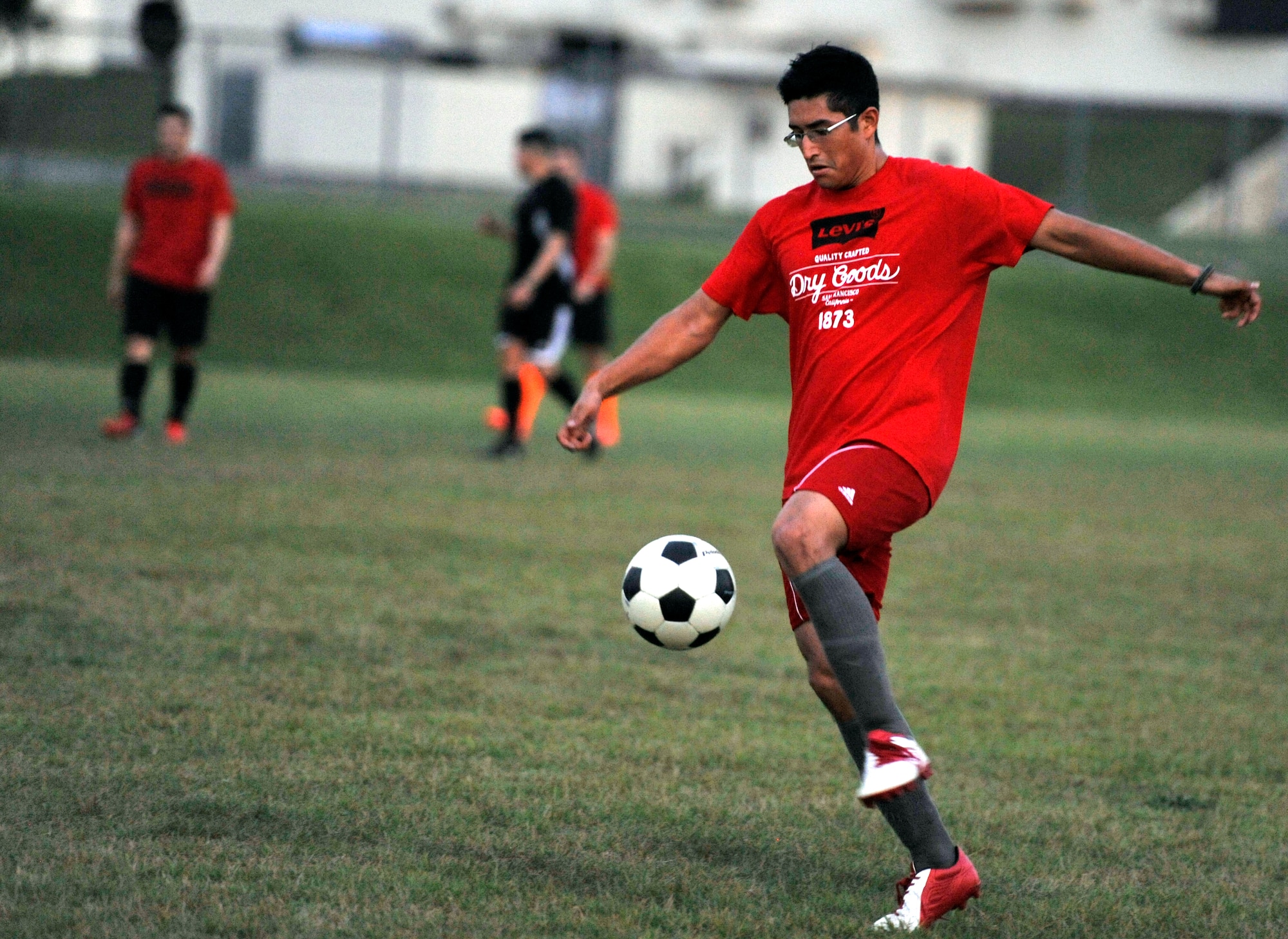 U.S. Air Force Senior Airman Jude Lekan, 35th Communications Squadron, controls the ball during an intramural soccer game at Misawa Air Base, Japan, Aug. 21, 2012. Each team in the intramural soccer league has now played one game and is looking to get off to the right start. (U.S. Air Force photo by Airman 1st Class Zachary Kee/Released)