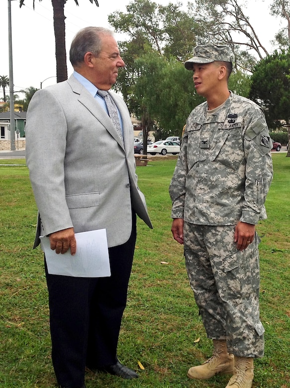Col. Mark Toy, commander of the Army Corps of Engineers Los Angeles District, shares thoughts with Long Beach Mayor Bob Foster before the news conference announcing completion the second phase of the Colorado Lagoon Ecosystem Restoration Project. The city will hold a public ceremony Saturday, Aug. 25, for the reopening of the lagoon for public use. 