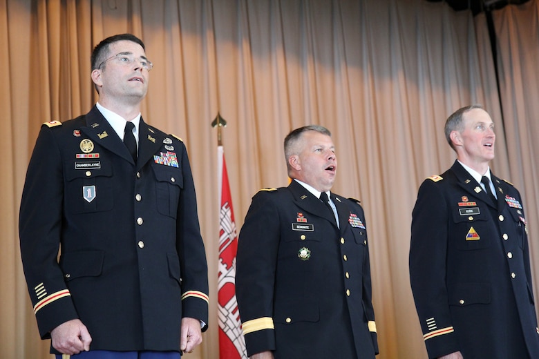 (from left) Lt. Col. Edward Chamberlayne, Maj. Gen. Todd Semonite (SAD Commander), and Lt. Col. Jason Kirk (former SAC Commander) stand at attention during the ceremony.