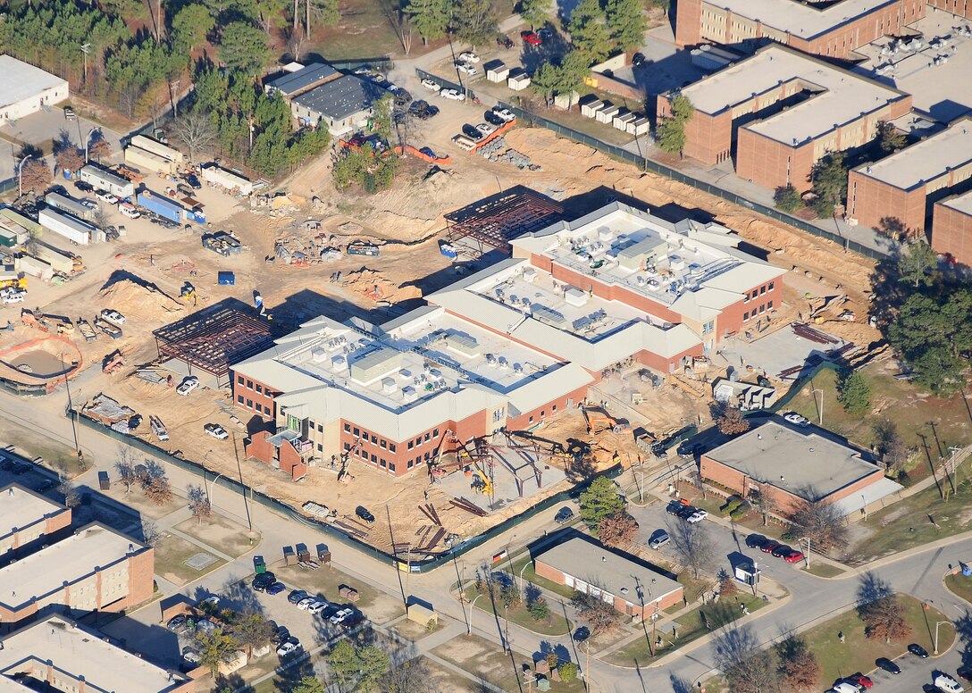 An aerial view of the Quad Dining Facility with starship buildings surrounding it.