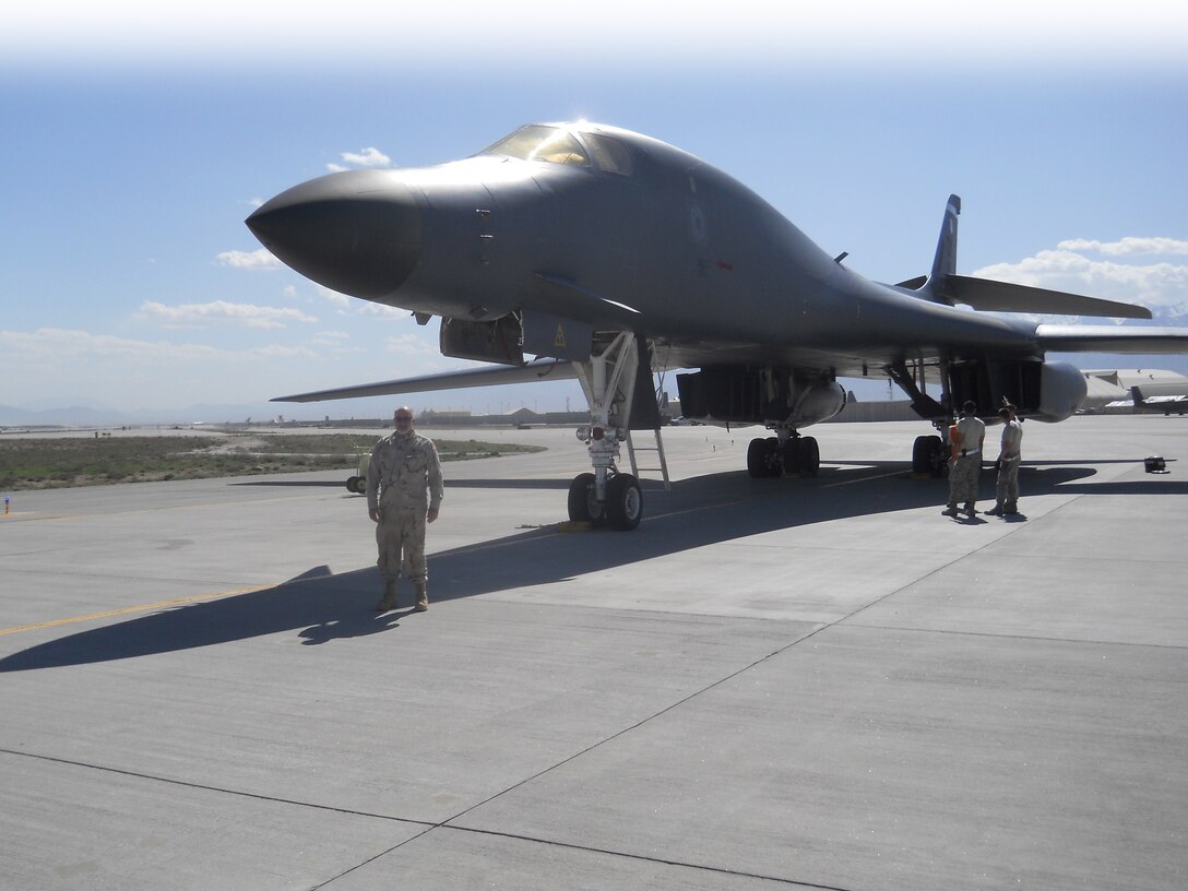 John Lindsay standing on the Bagram Air Field runway.