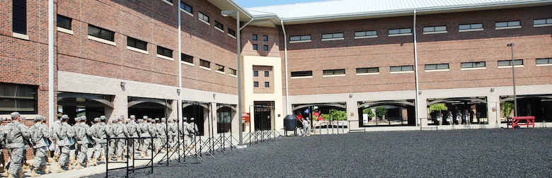 Soldiers marching outside their new BTC complex.