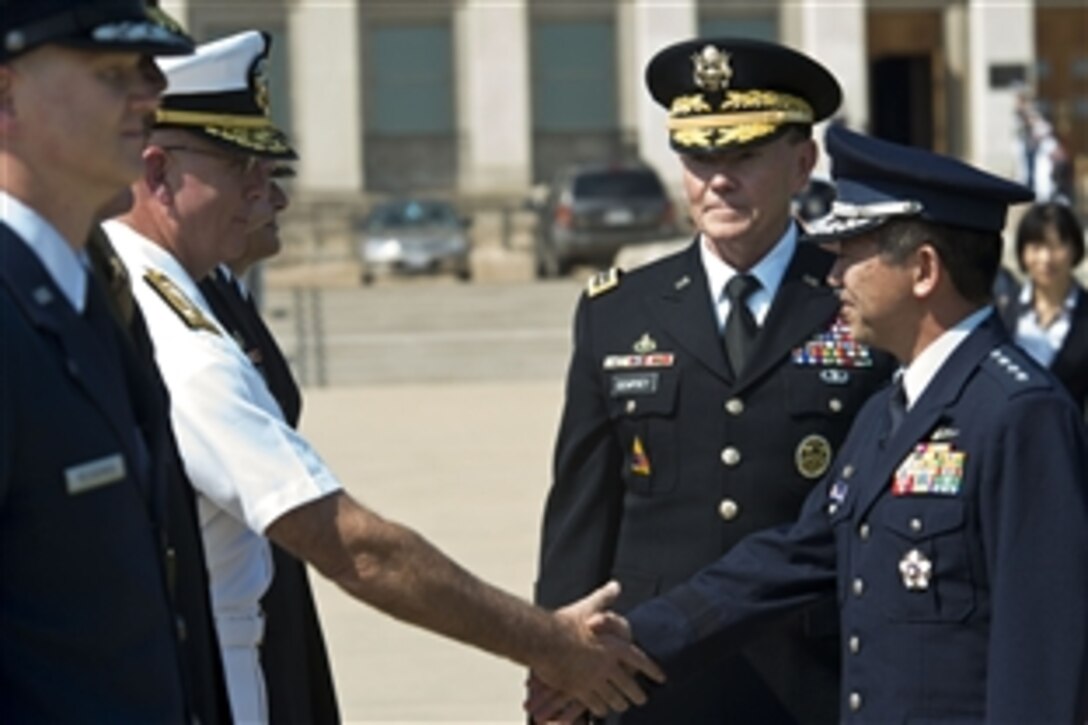 U.S. Army Gen. Martin E. Dempsey, chairman of the Joint Chiefs of Staff, introduces Gen. Shigeru Iwasaki, chief of joint staff for Japan Self Defense Forces, to his staff during an honor cordon at the Pentagon, Aug. 23, 2012. 