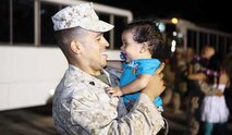 Sgt. Junior R. Infante holds his 9-month-old son, Jacob, during the homecoming for Combat
Logistics Battalion 4 at Camp Foster Aug. 21. Infante is a motor vehicle operator with CLB-4,
Combat Logistics Regiment 3, 3rd Marine Logistics Group, III Marine Expeditionary Force.