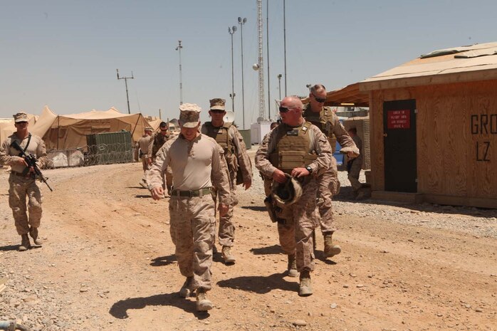 U.S. Marine Corps Lt. Col. Edward J. Healey, left, battalion commander of 3rd Battalion, 8th Marine Regiment (3/8), Regimental Combat Team 6 and Maj. Gen. Walter L. Miller, right, commanding general of Marine Air Ground Task Force 13 walk to the command operations center on Forward Operating Base (FOB) Geronimo, Helmand province, Afghanistan Aug. 18, 2012. Maj. Gen. Miller along with Task Force Leatherneck command staff visited FOB Geronimo to discuss future operations in the 3/8 area of operation. (U.S. Marine Corps photo by Lance Cpl. Cesar N. Contreras/Released)