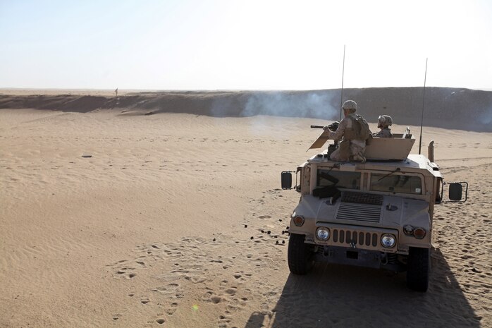 UDAIRI RANGE, Kuwait (Aug. 16, 2012) A U.S. Marine assigned to Combat Logistics Battalion 24, 24th Marine Expeditionary Unit, fires a MK19 40mm automatic grenade launcher at Udairi Range in Kuwait, Aug. 16, 2012. The 24th MEU is deployed with the Iwo Jima Amphibious Ready Group as a U.S. Central Command theater reserve force providing support for maritime security operations and theater security cooperation efforts in the U.S. 5th Fleet area of responsibility. (U.S. Marine Corps photo by Sgt. Richard Blumenstein/Released)