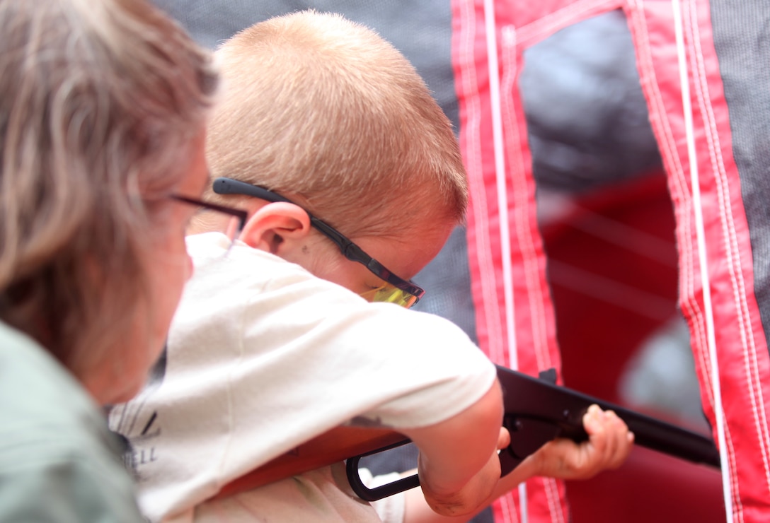 A child prepares to shoot into a target with a BB gun at the Frogman 3-D Bowhunters challenge Aug. 18. The event had an archery course along with many activities for children, such as a fishing tournament.  